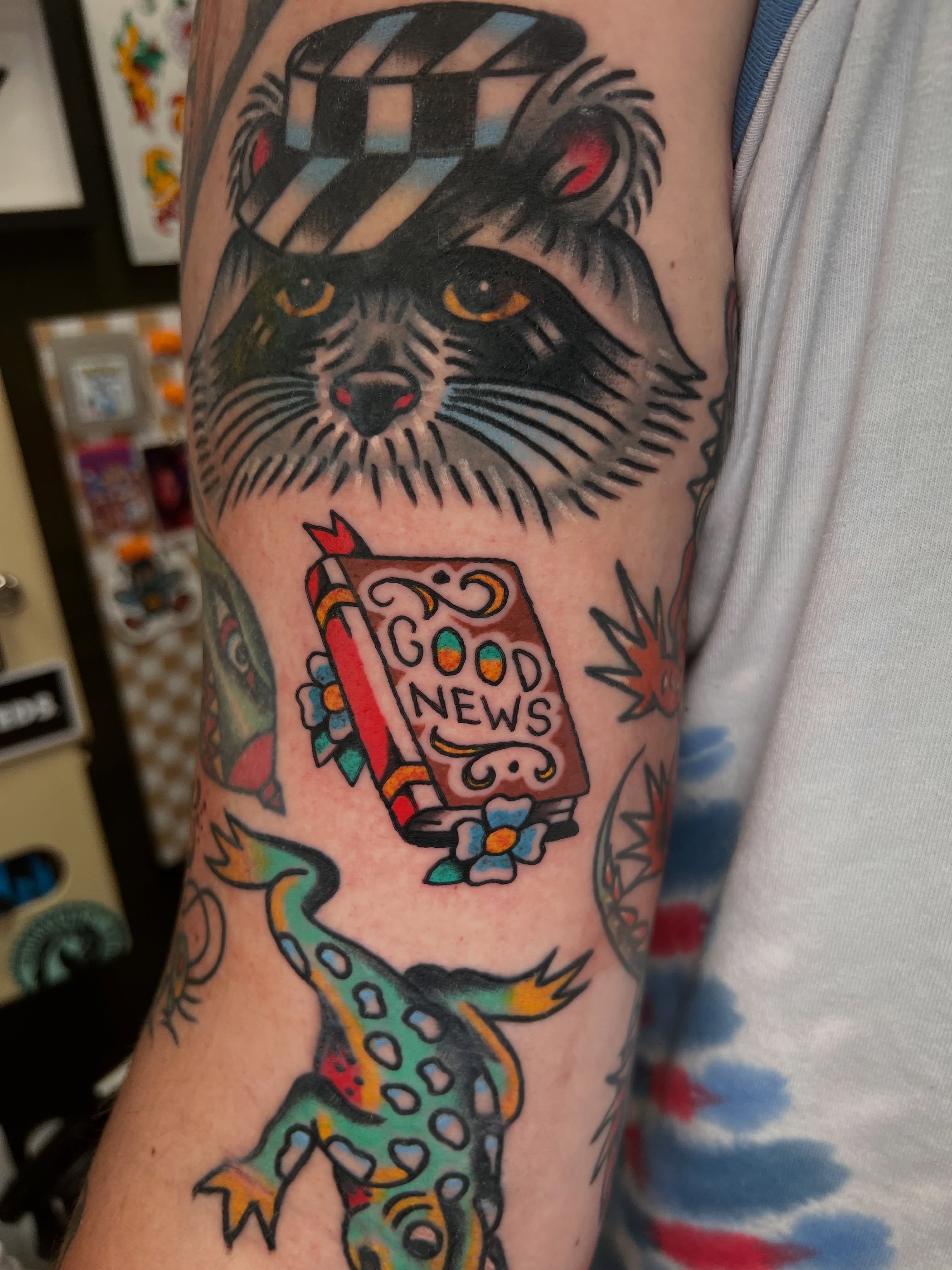 Raccoon and book American traditional tattoo on the forearm by 🍊Harvey Perez 🍊, Deerfield Beach, Florida