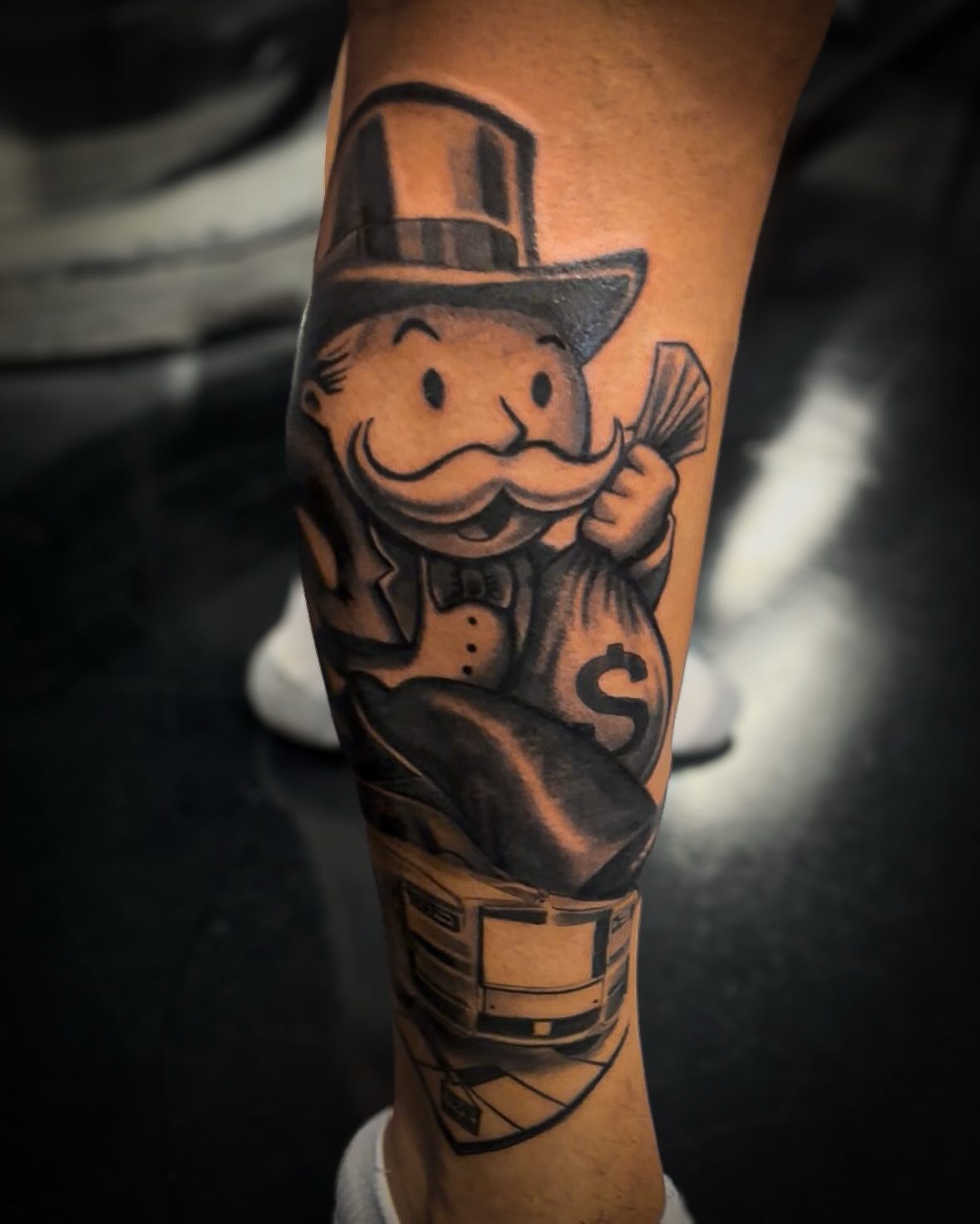 Monopoly man American traditional tattoo on the forearm by J.diaz🎖️