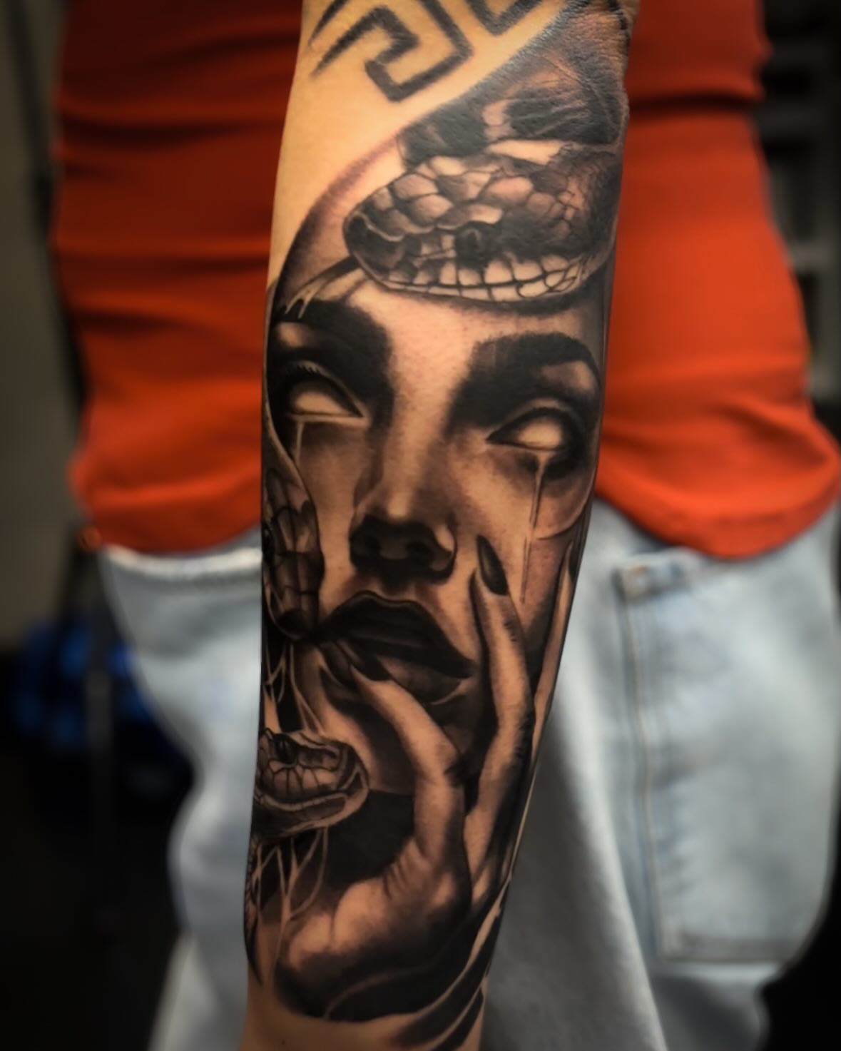 Woman's face with snake realism tattoo on the forearm by J.diaz🎖️