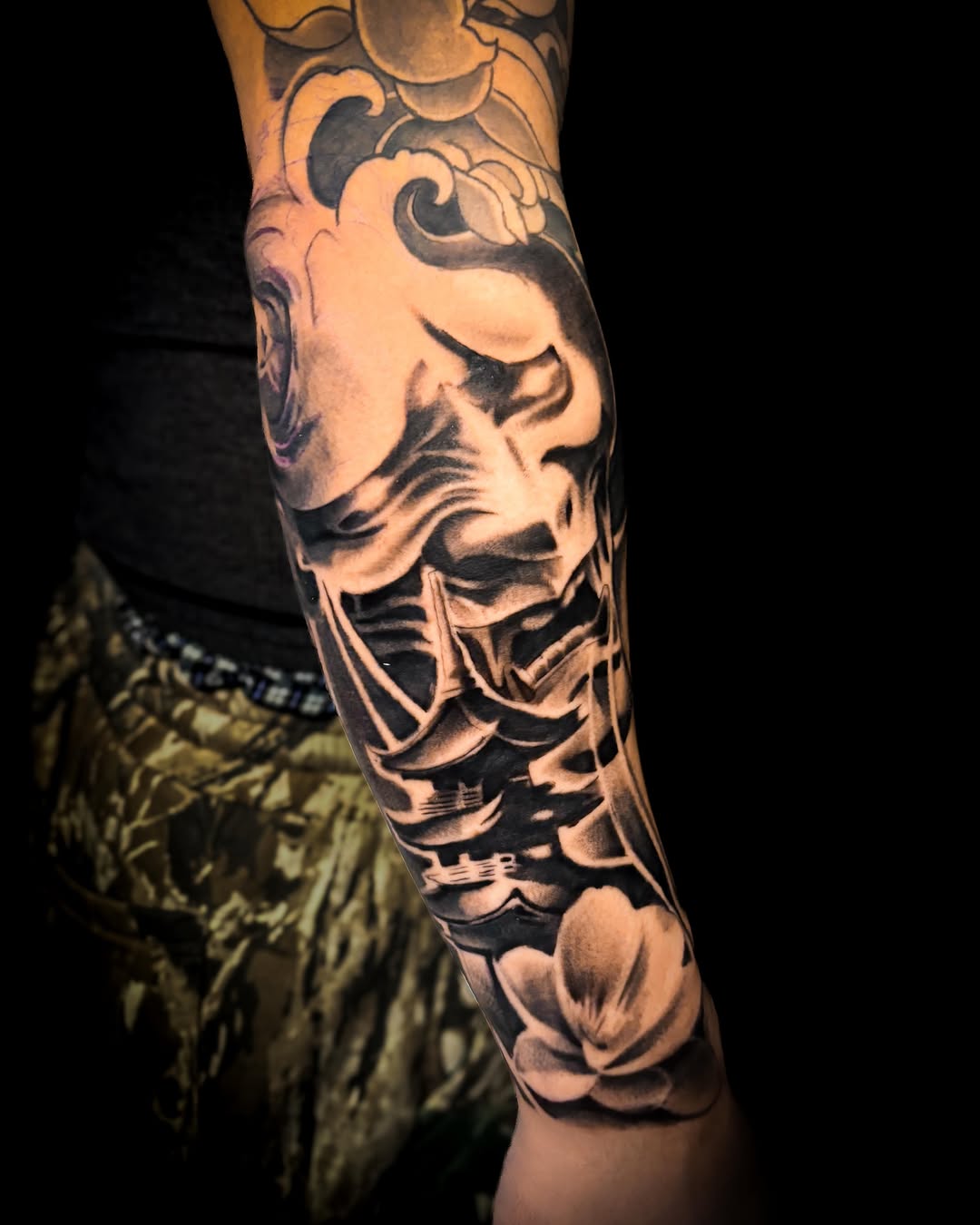 Skull and flowers realism tattoo on the forearm by J.diaz🎖️