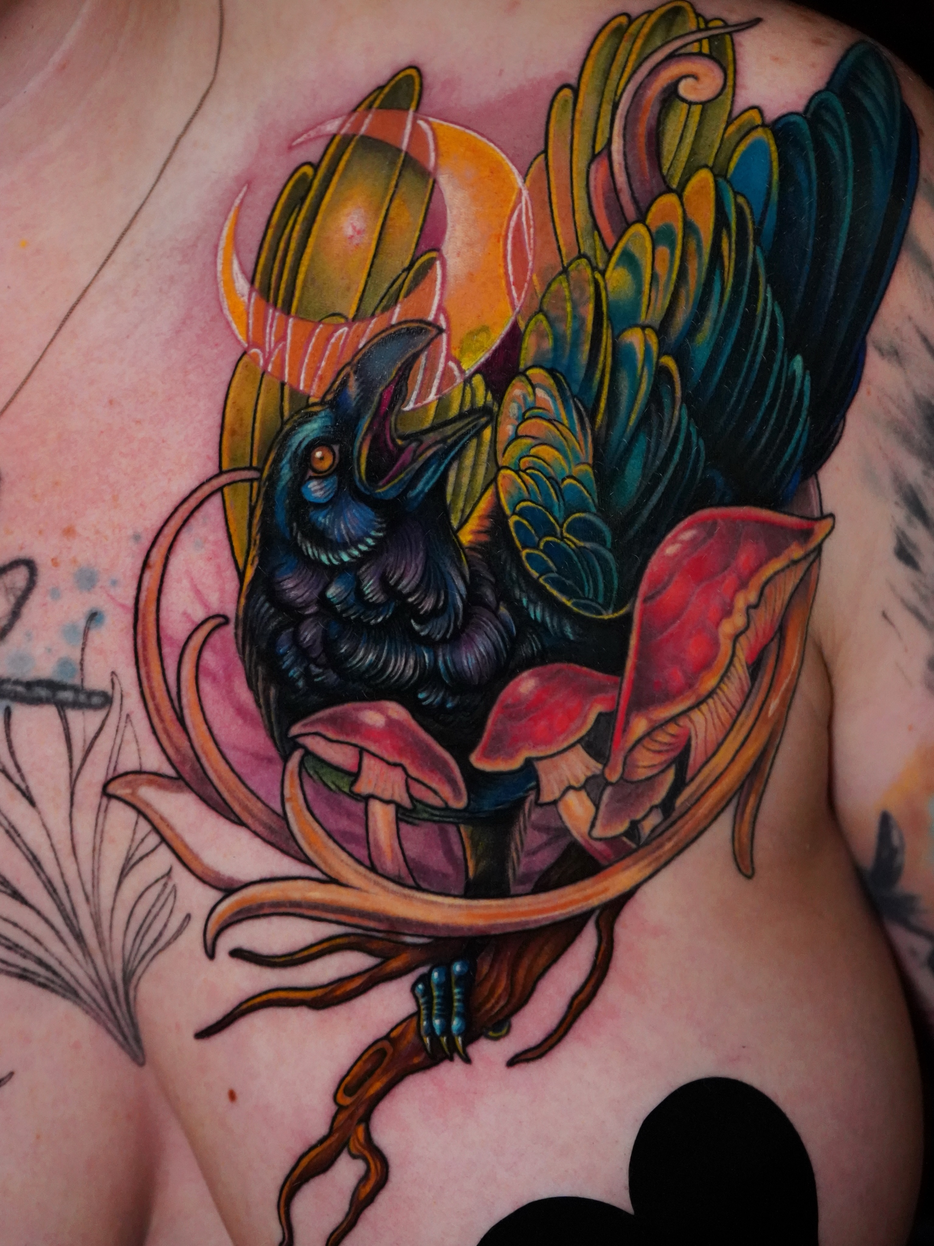 Crow and mushrooms new school tattoo on the chest by Haley Corinne