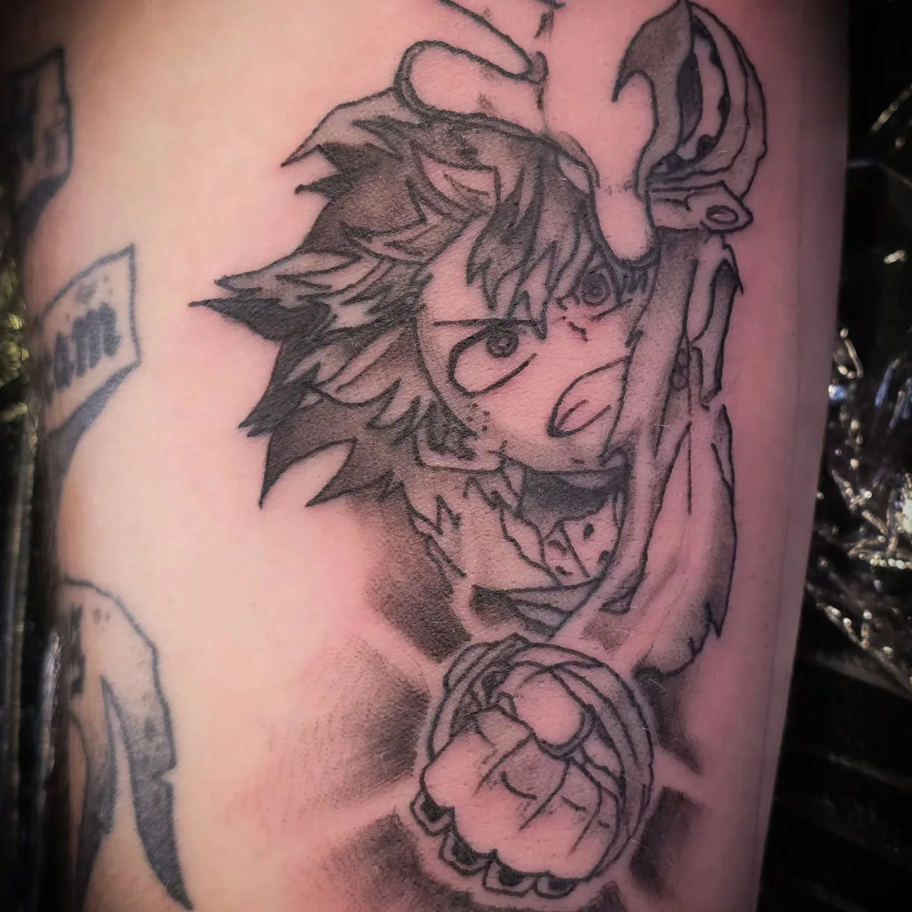 Anime character anime tattoo on the forearm by Betty Browning