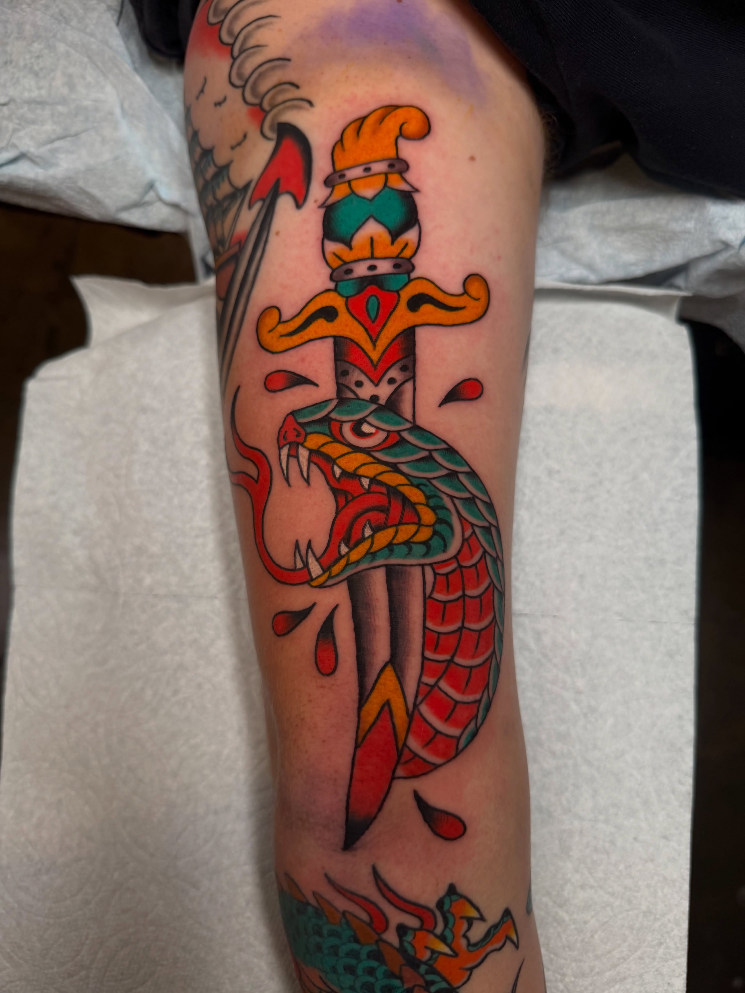 Dragon and sword American traditional tattoo on the forearm by Tyler Brown, San Diego, California