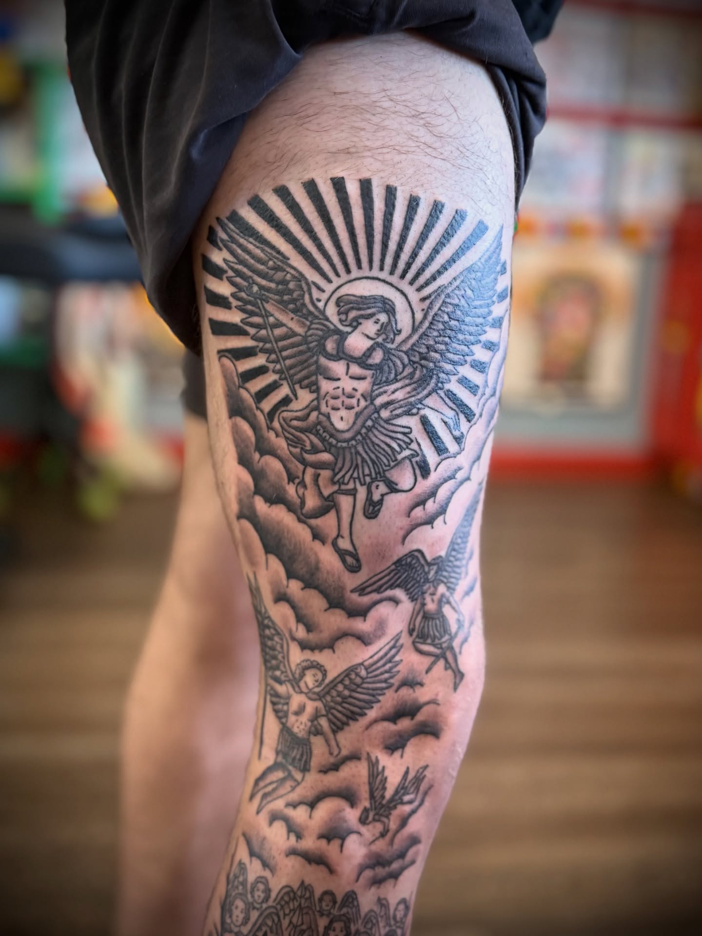 Angelic figures American traditional tattoo on the thigh by Justin Bianchini - New Orleans Tattoo Artist