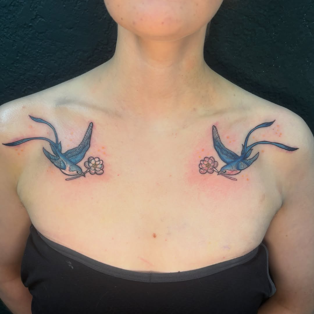 Swallows and flowers American traditional tattoo on the chest by Emma ๐