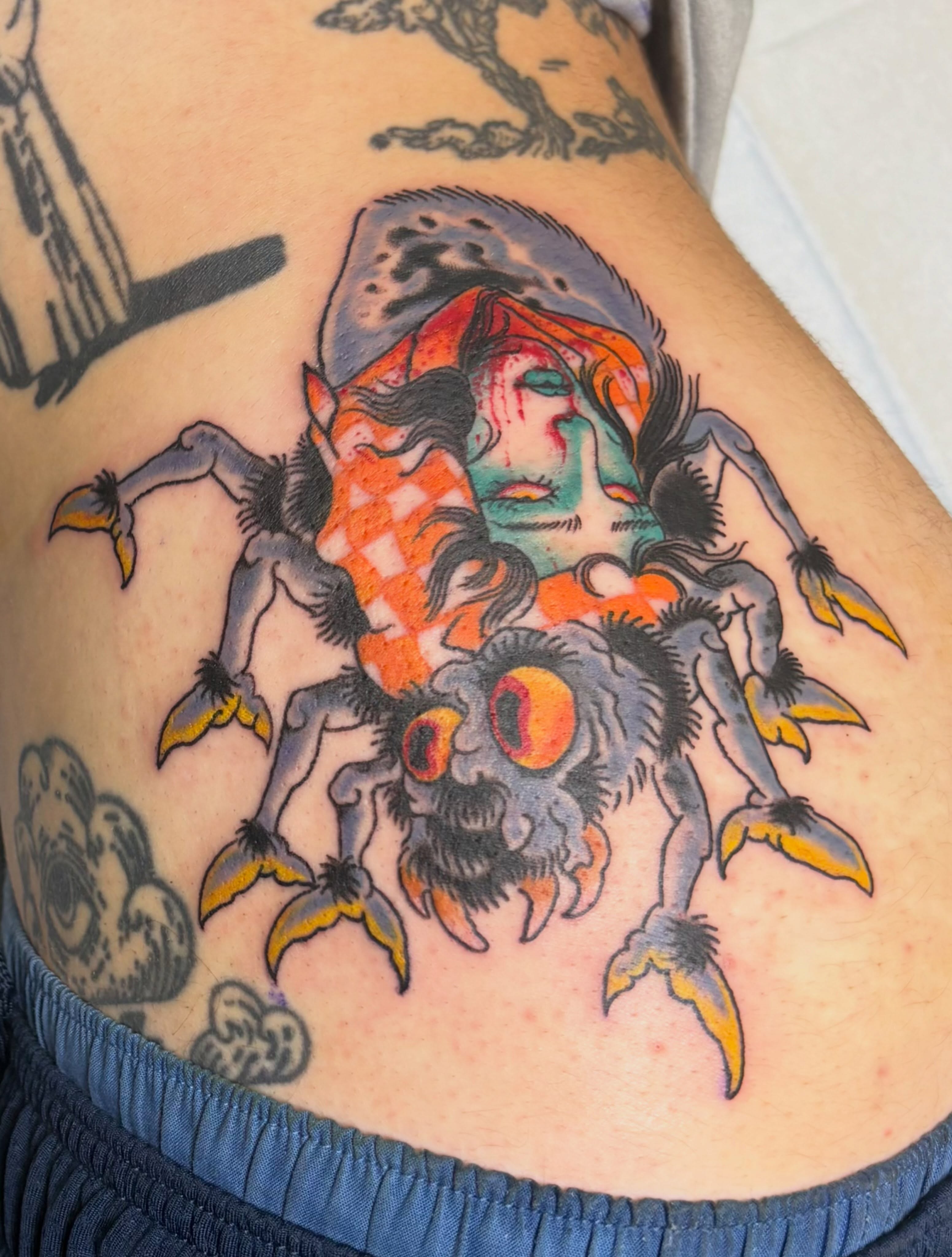 Spider with human head American traditional tattoo on the thigh by Gabby, Kansas City, Missouri
