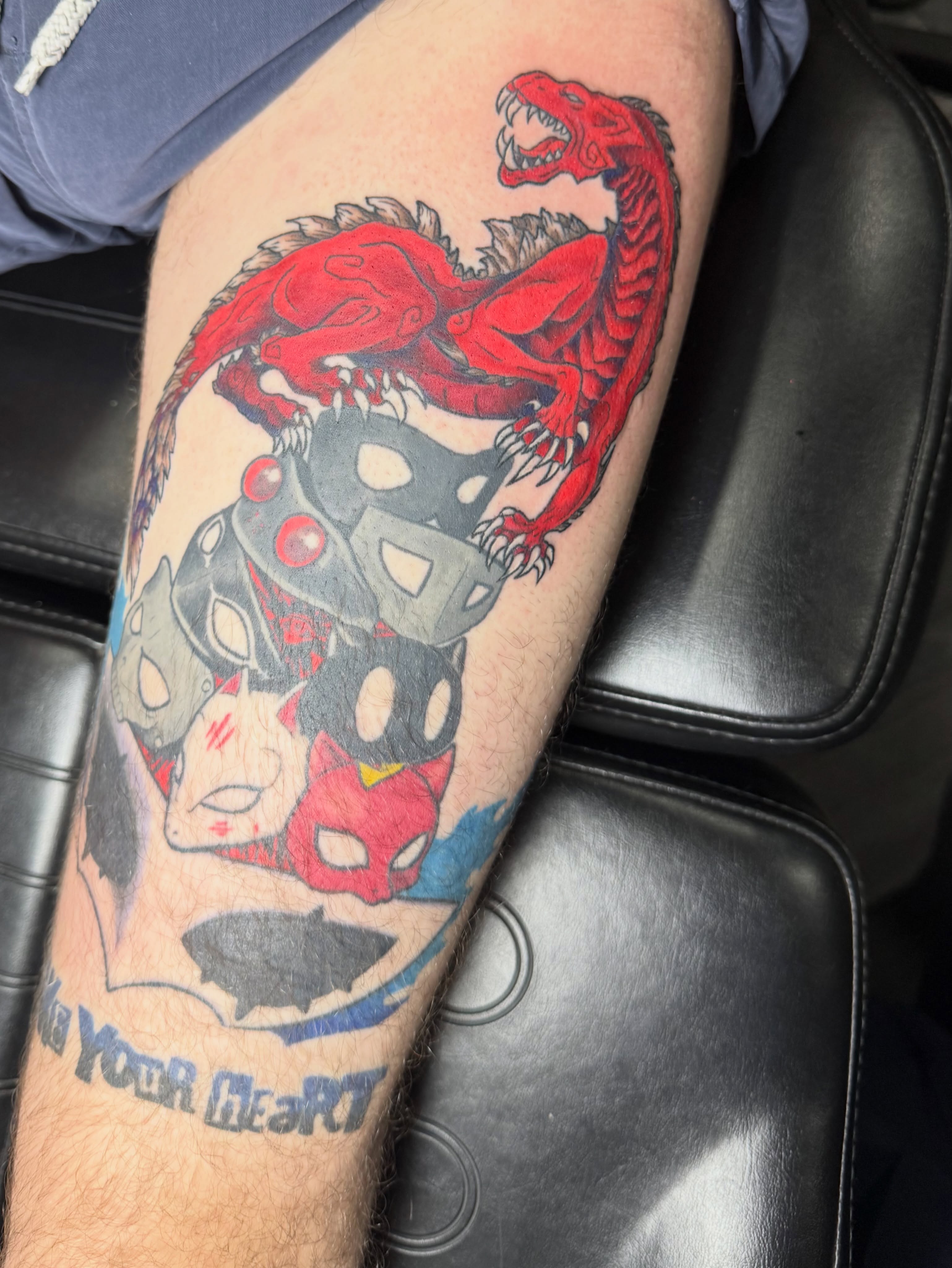 Dragon and mask dotwork tattoo on the forearm by Camryn Justice