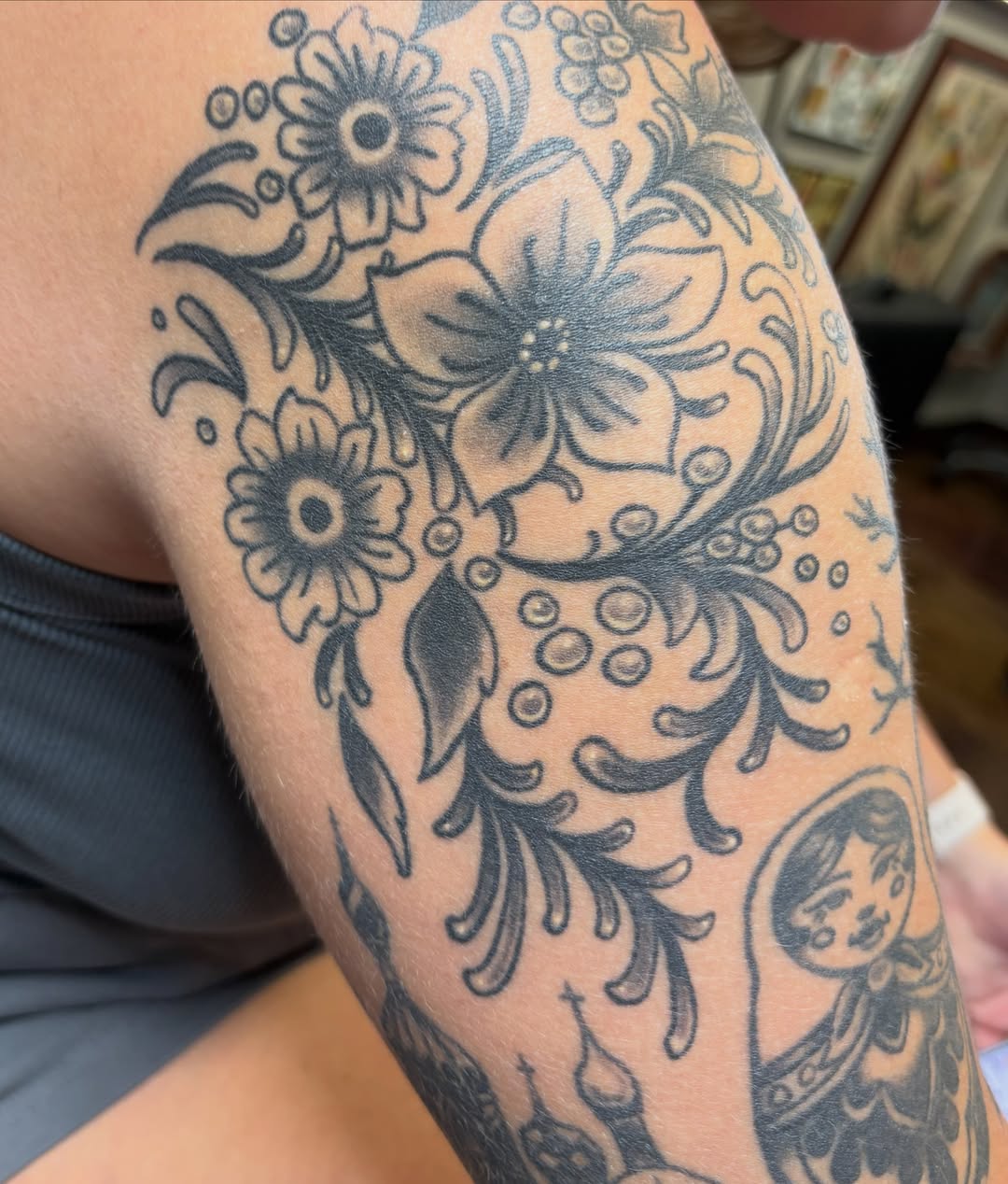 Floral design black and grey tattoo on the forearm by Gabby, Kansas City, Missouri