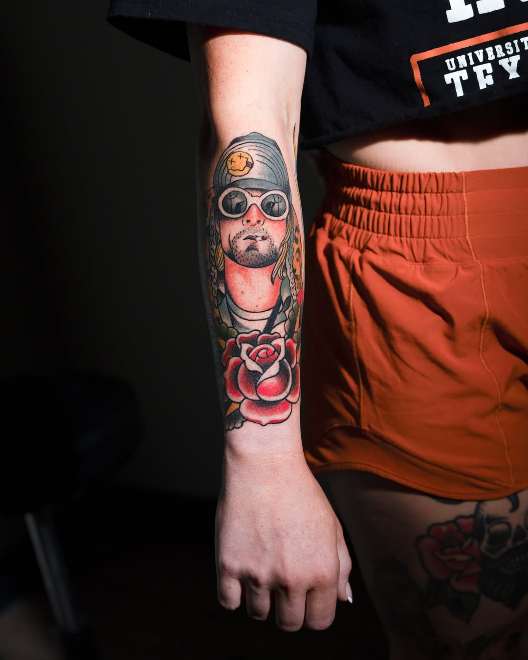 Portrait with rose American traditional tattoo on the forearm by Danny Pando