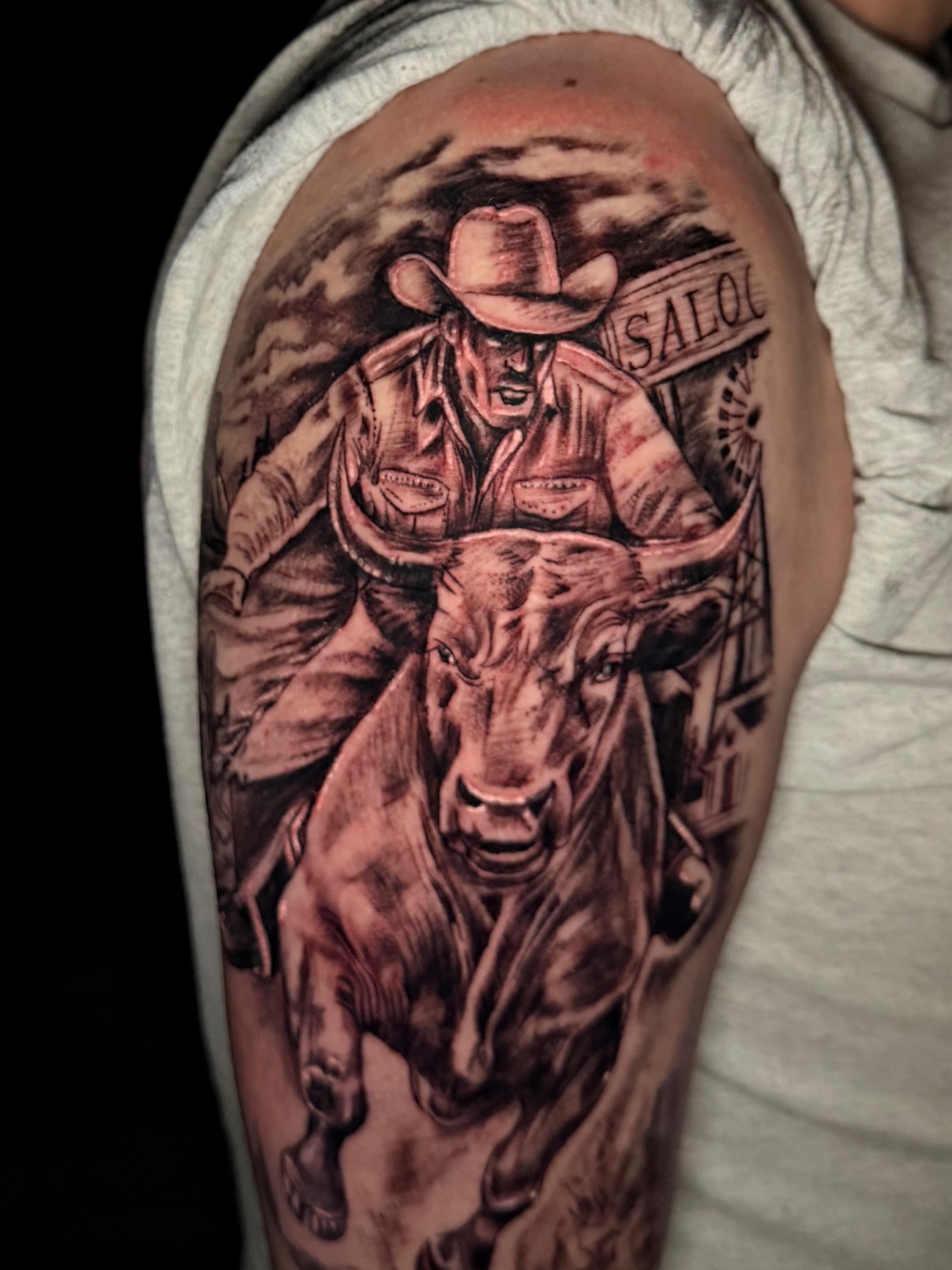 Bull riding realism tattoo on the forearm by Martin Melendrez