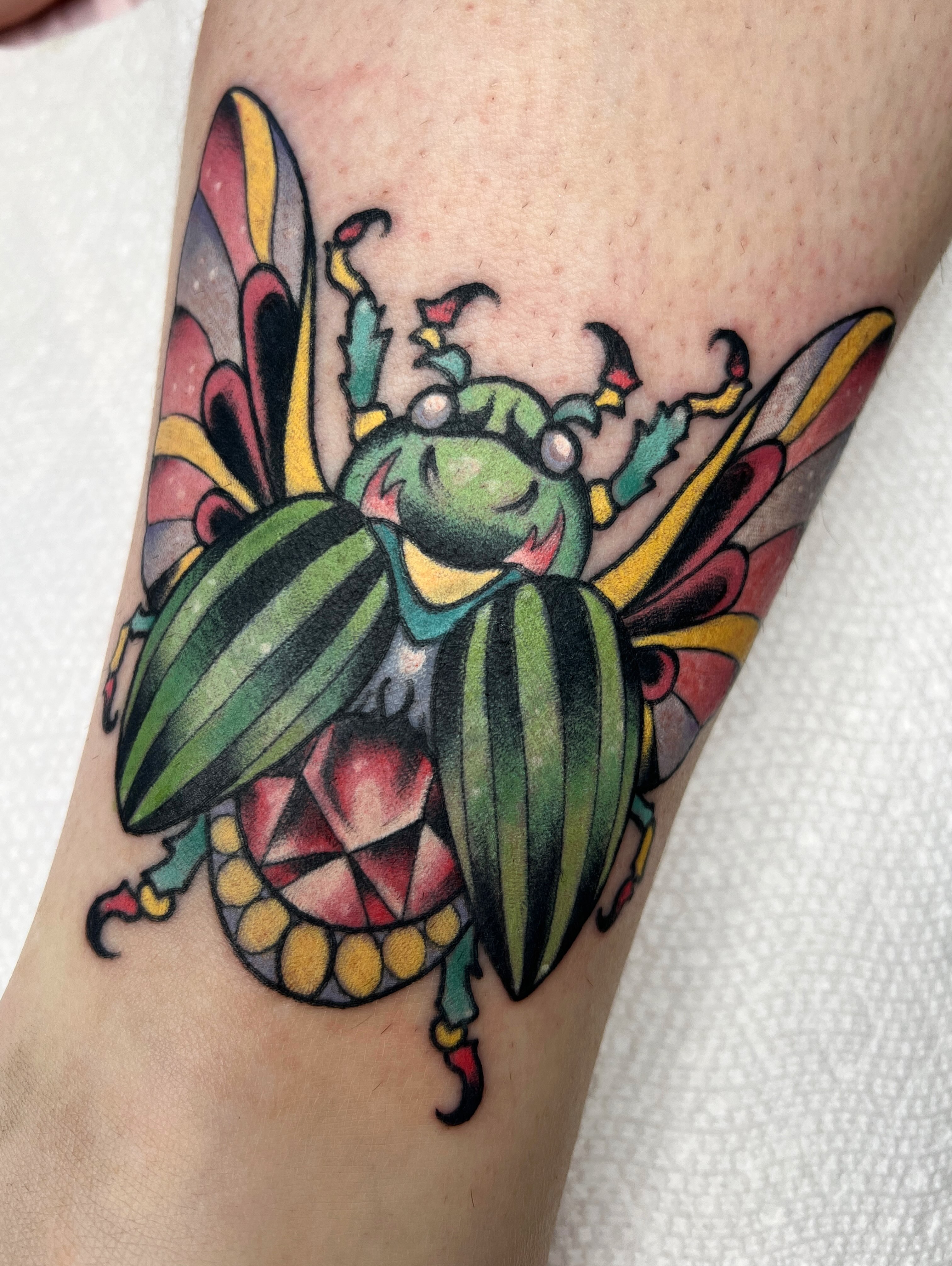Beetle American traditional tattoo on the forearm by Leo 🌞 Pdx Tattoo