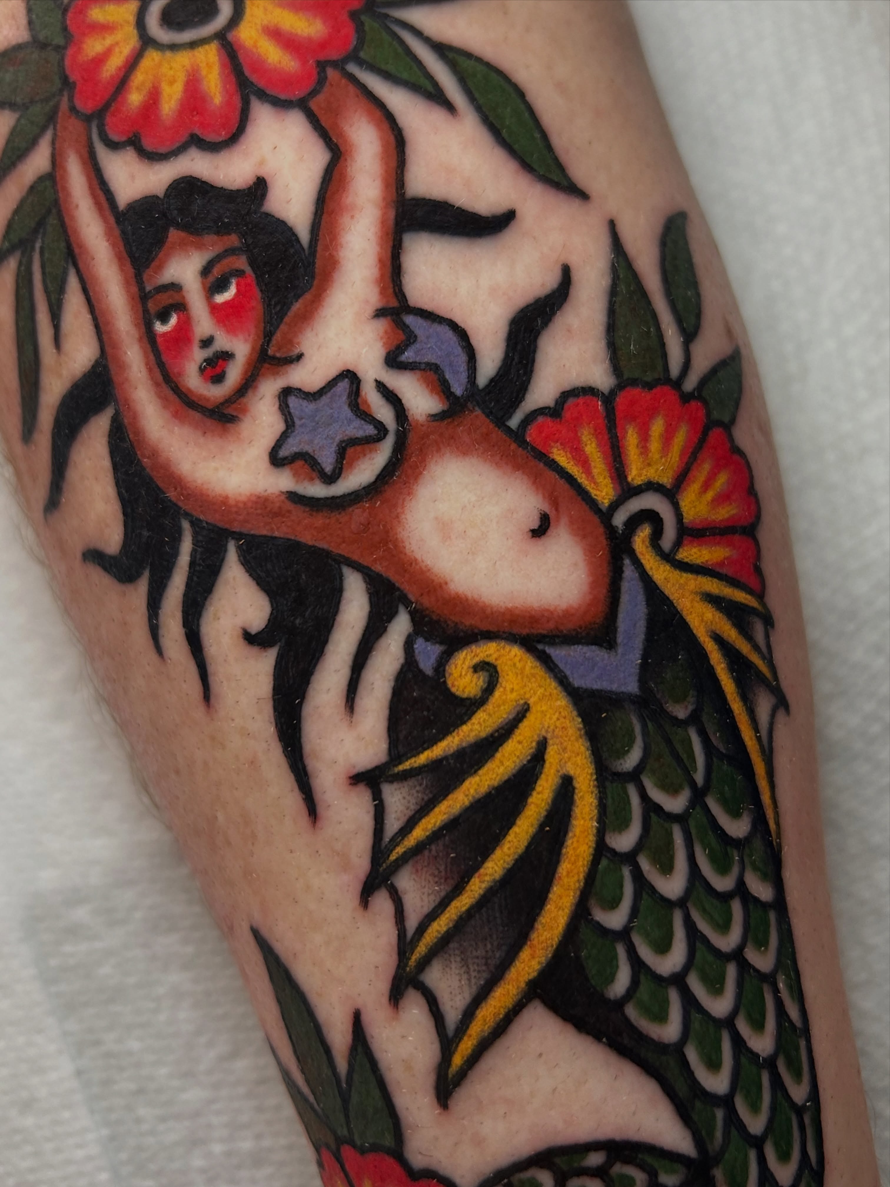 Mermaid American traditional tattoo on the forearm by Mitch Hoggard