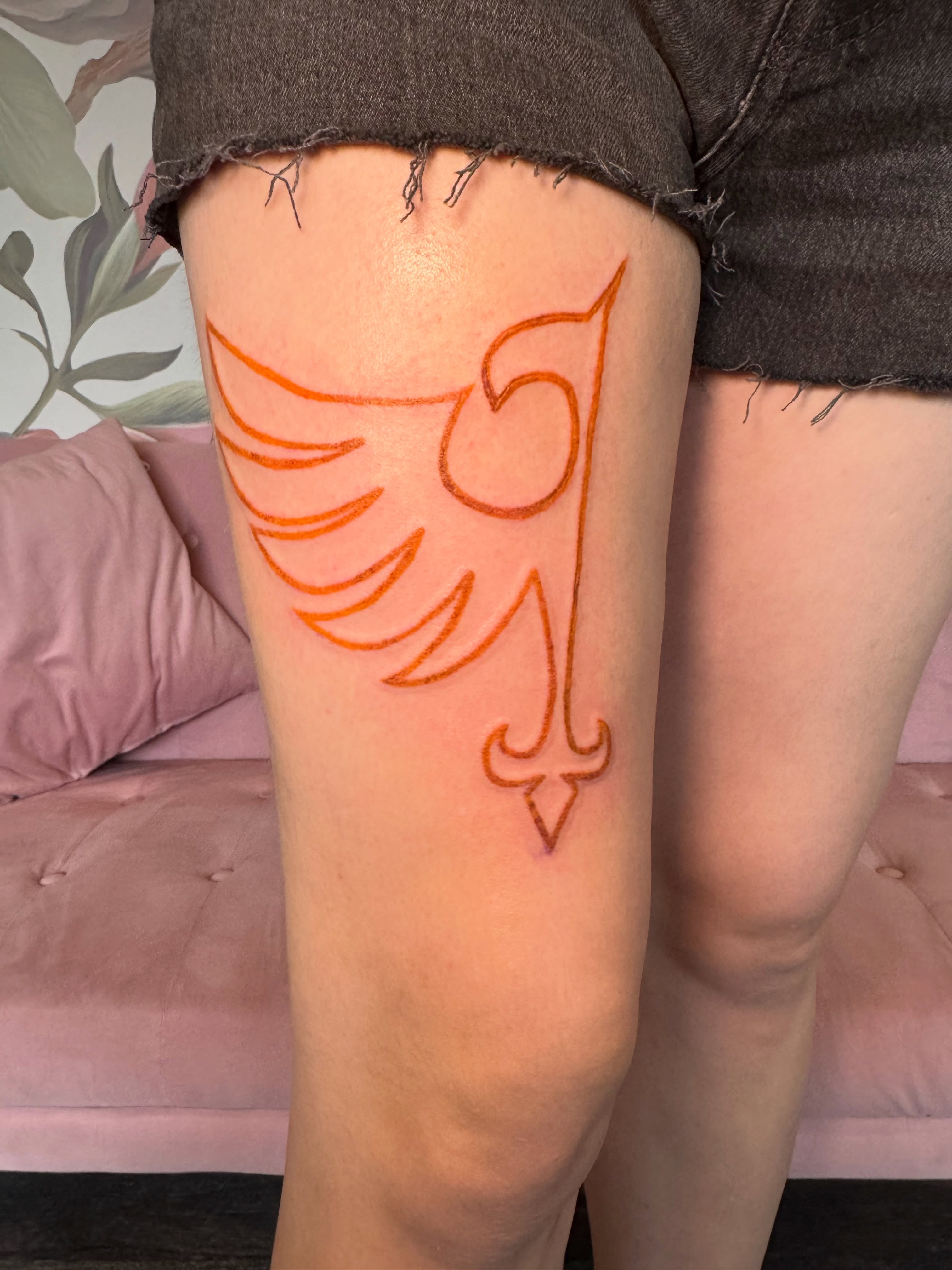 Bird geometric tattoo on the thigh by Kinzi Brown