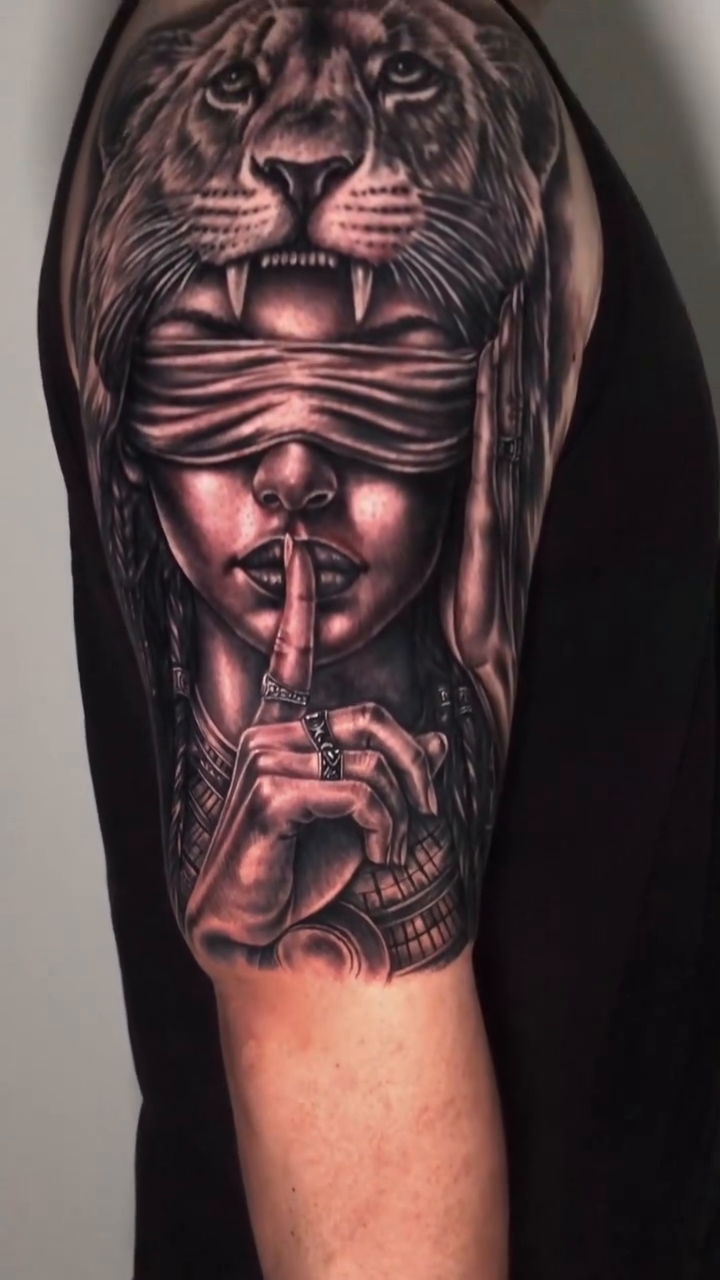 Blindfolded woman with lion headdress realism tattoo by Danny Rodriguez