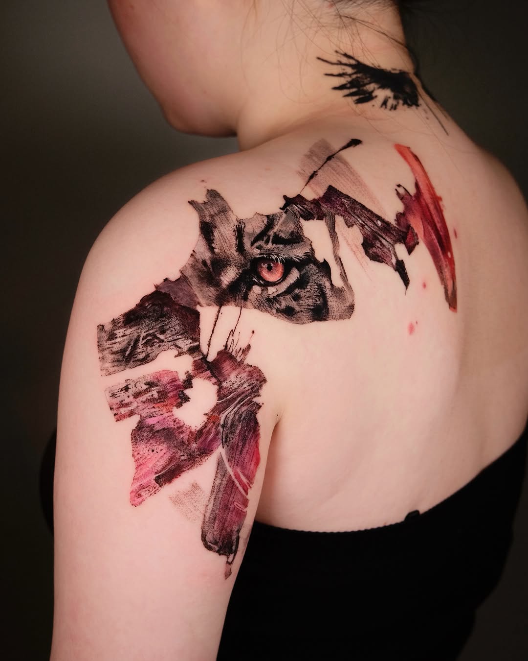 Abstract face watercolor tattoo on the shoulder by Eva Liu