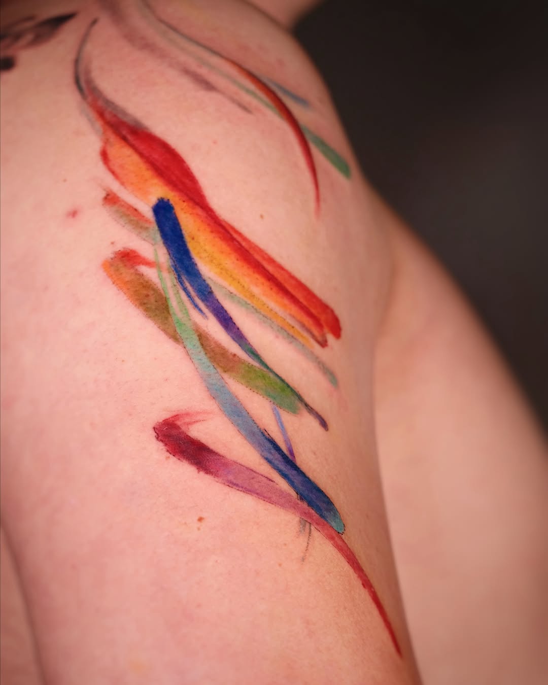 Abstract swirls watercolor tattoo on the shoulder by Eva Liu
