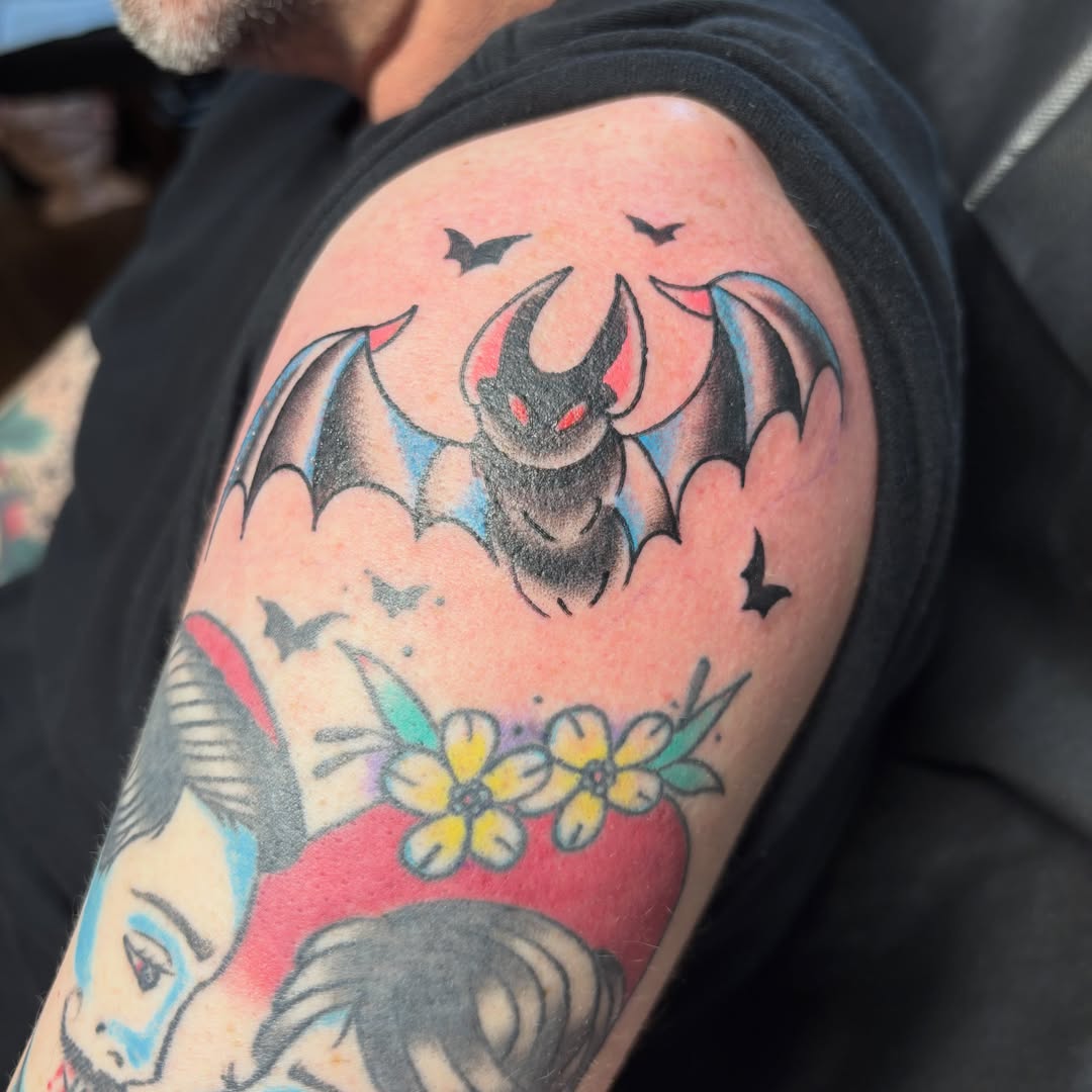 Bat and flowers American traditional tattoo on the upper arm by ❁ Tat2friend ❁