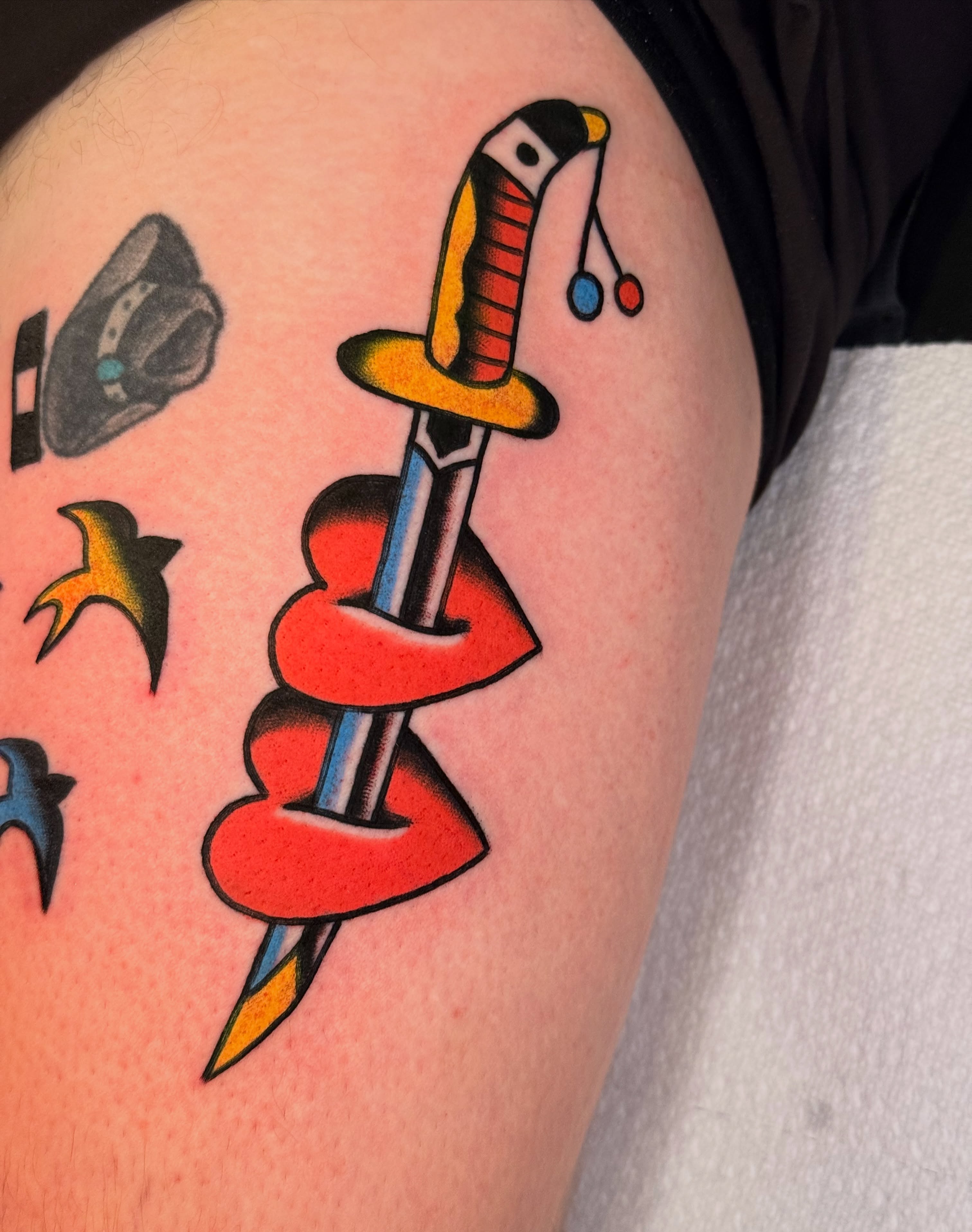 Sword and snake American traditional tattoo on the thigh by {{Theo Glanton}}