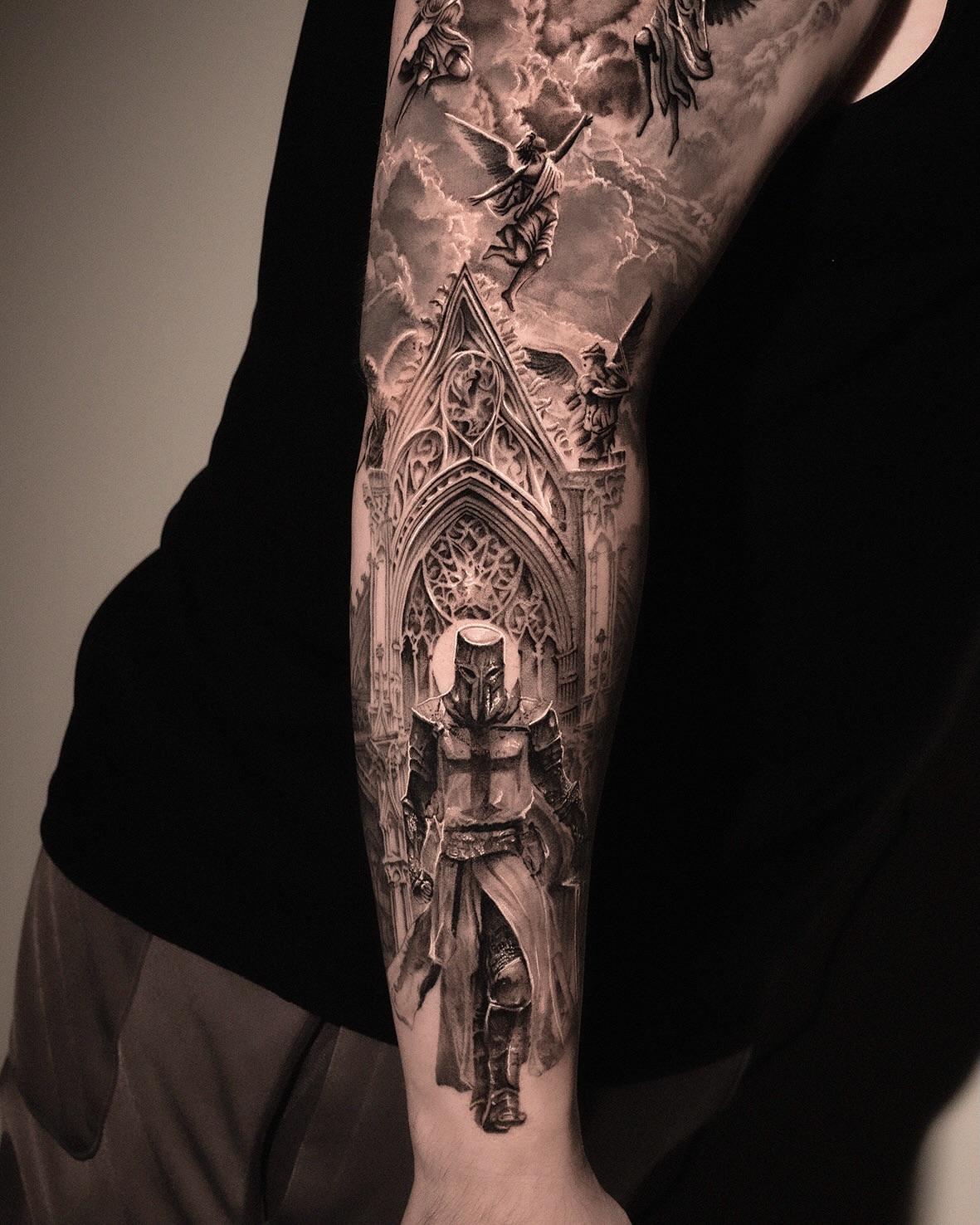 Gothic cathedral and knight realism tattoo on the forearm by AMU