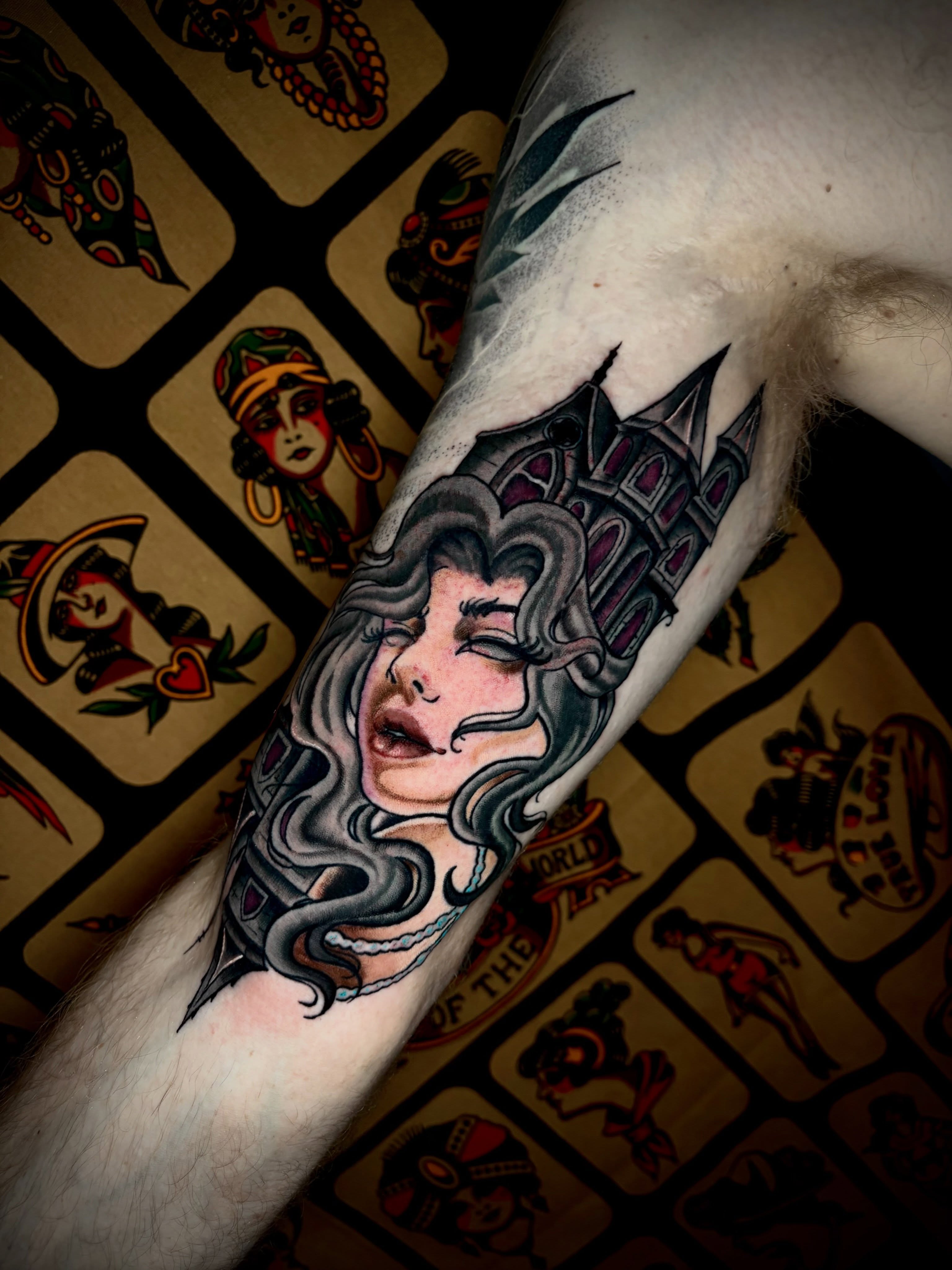 Woman with snakes American traditional tattoo on the forearm by Ashley Lin Las Vegas Tattoo Artist
