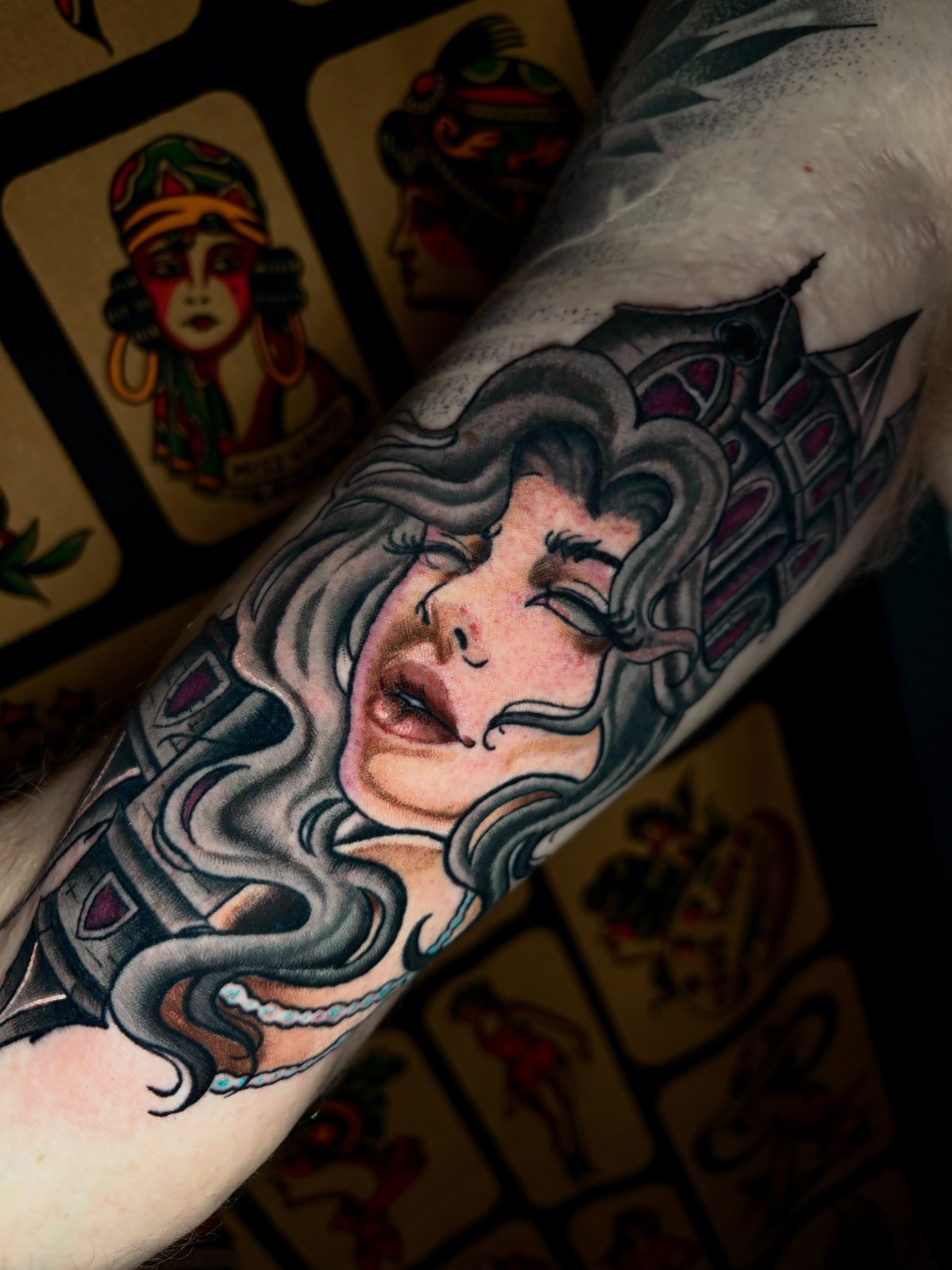 Woman with long hair American traditional tattoo on the forearm by Ashley Lin Las Vegas Tattoo Artist