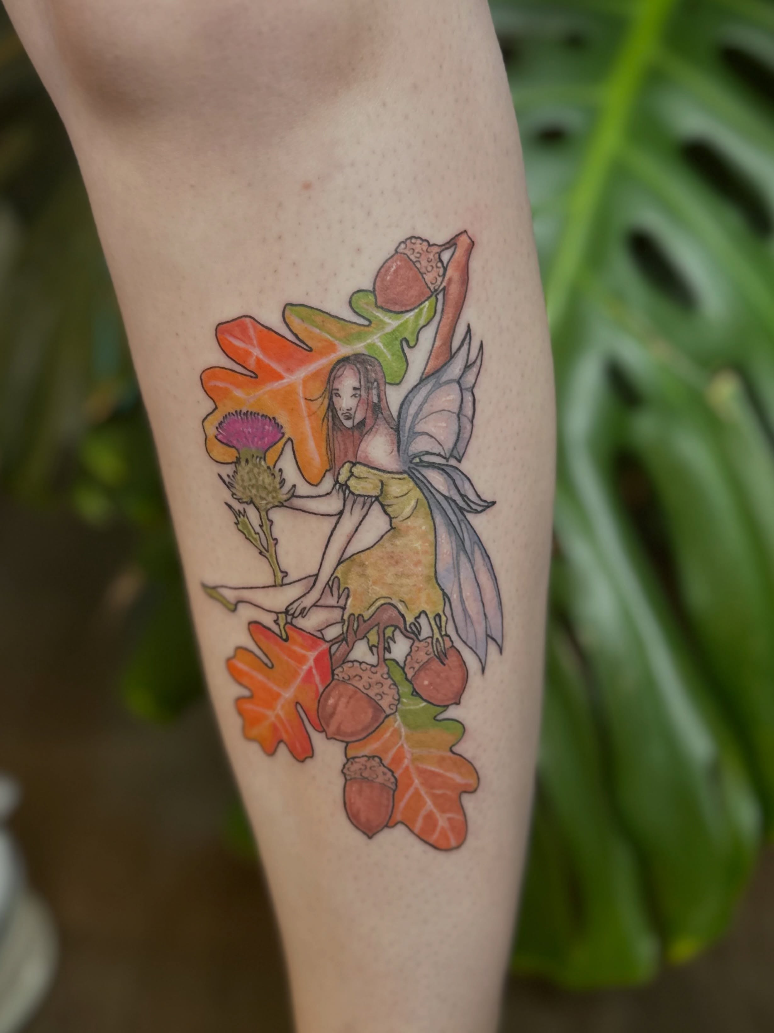 Fairy and autumn leaves new school tattoo on the forearm by Ransom