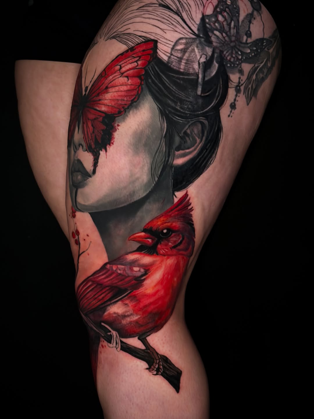 Woman and cardinal surrealism tattoo on the upper arm by ✨ Tattoo Artist