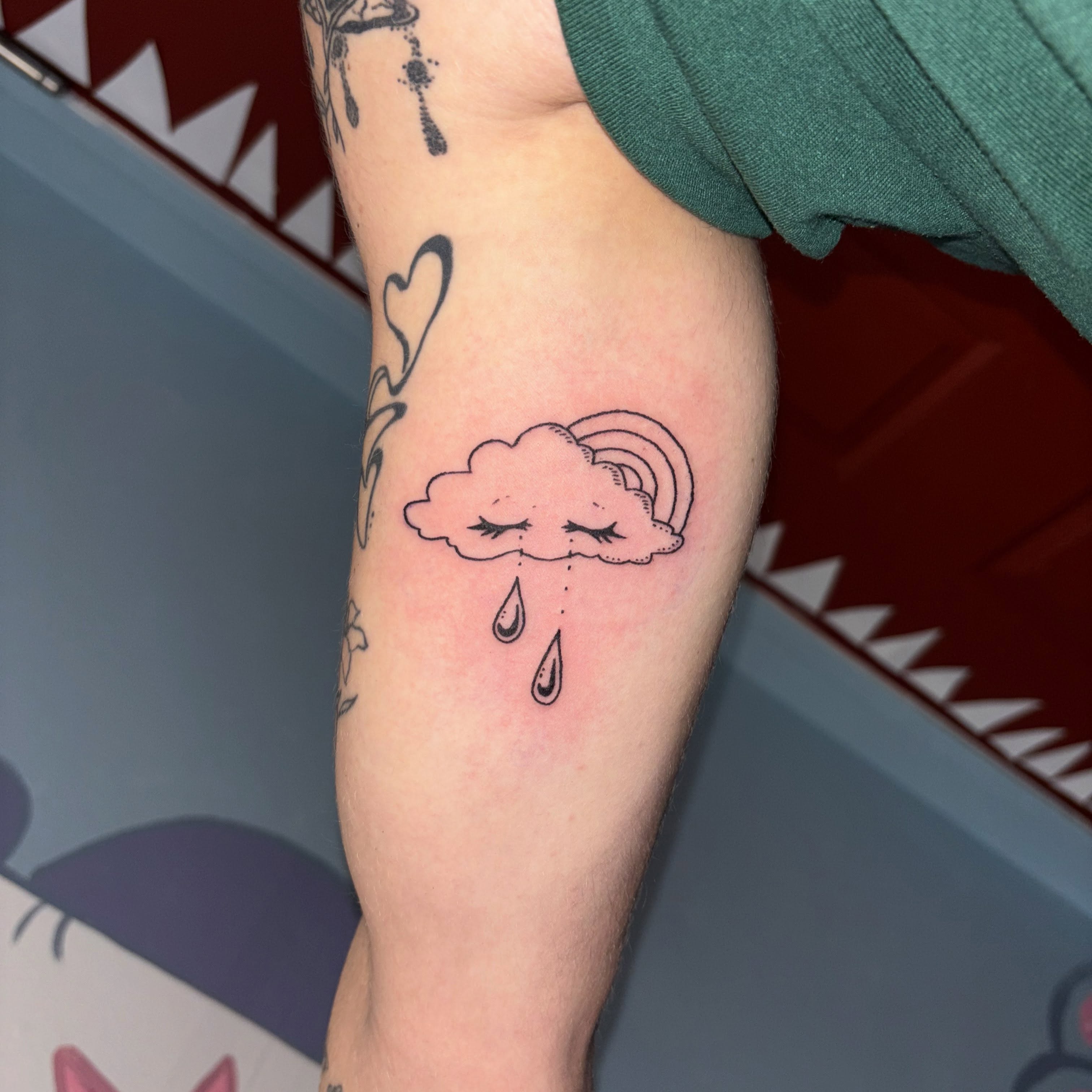 Rainbow cloud dotwork tattoo on the forearm by ☠️mikauley☠️