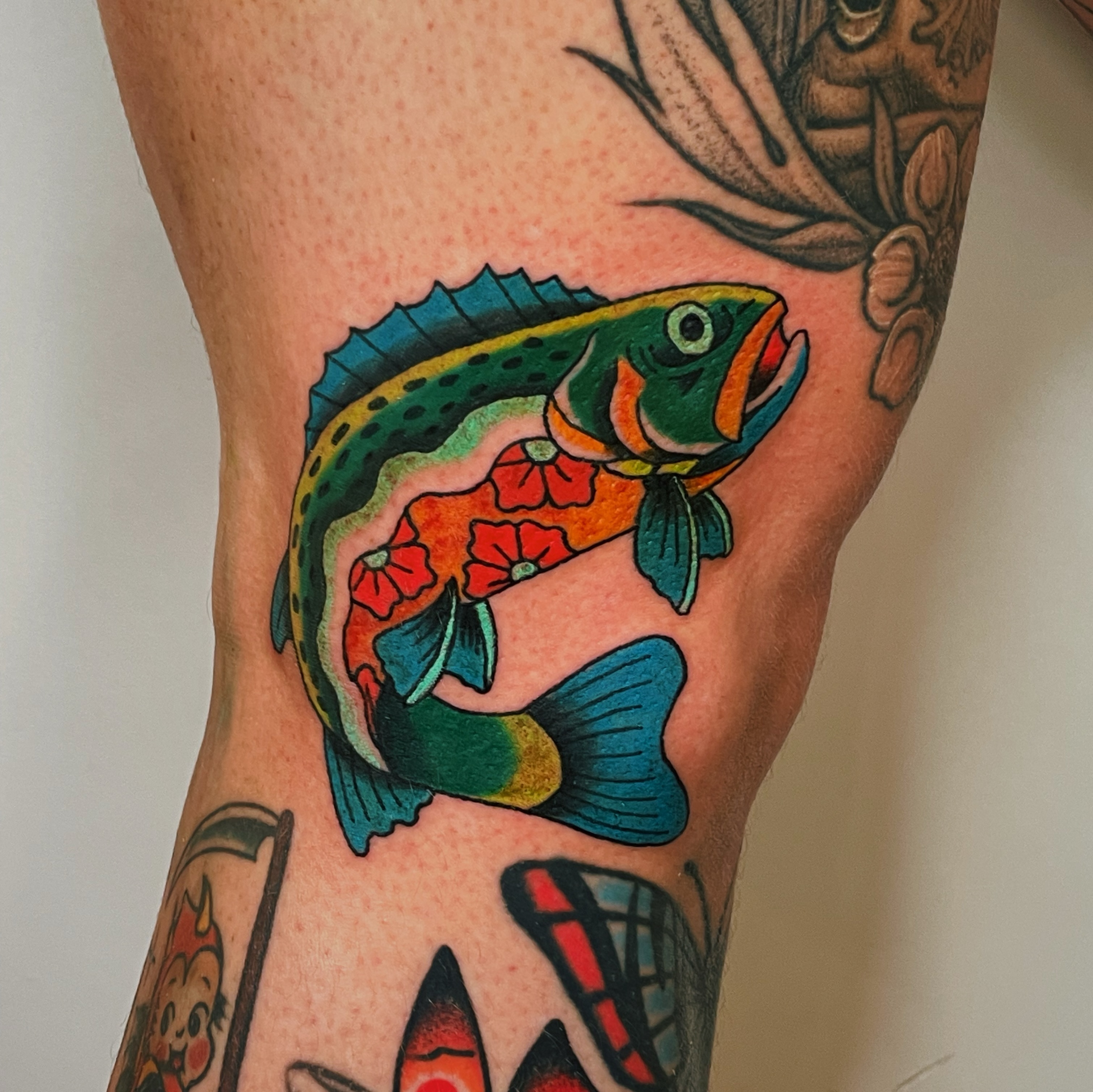 Fish American traditional tattoo on the forearm by Glume Tattoo