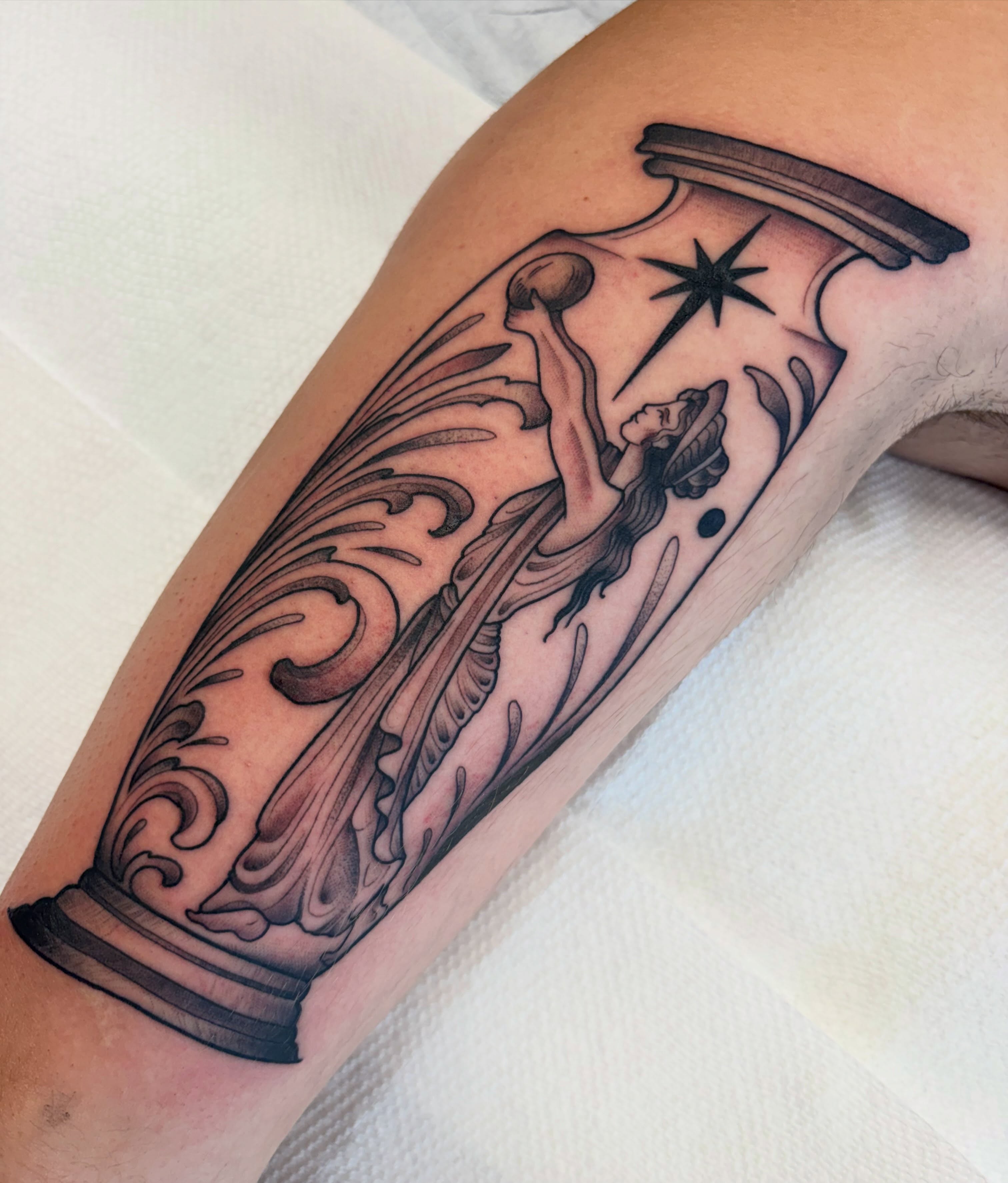 Column and angel realism tattoo on the forearm by Kayla Fay, Baton Rouge, Louisiana