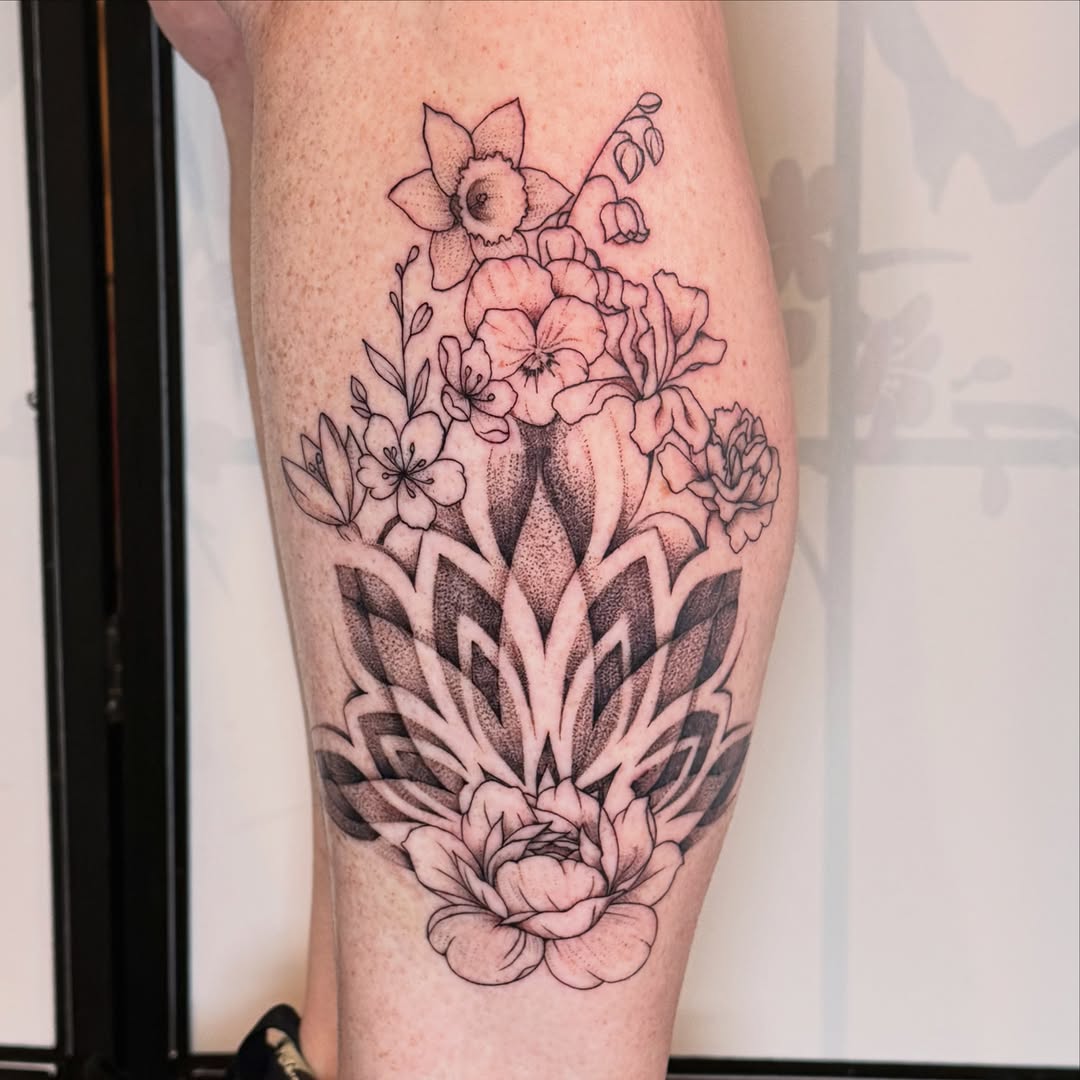 Flower bouquet dotwork tattoo on the calf by Cohen