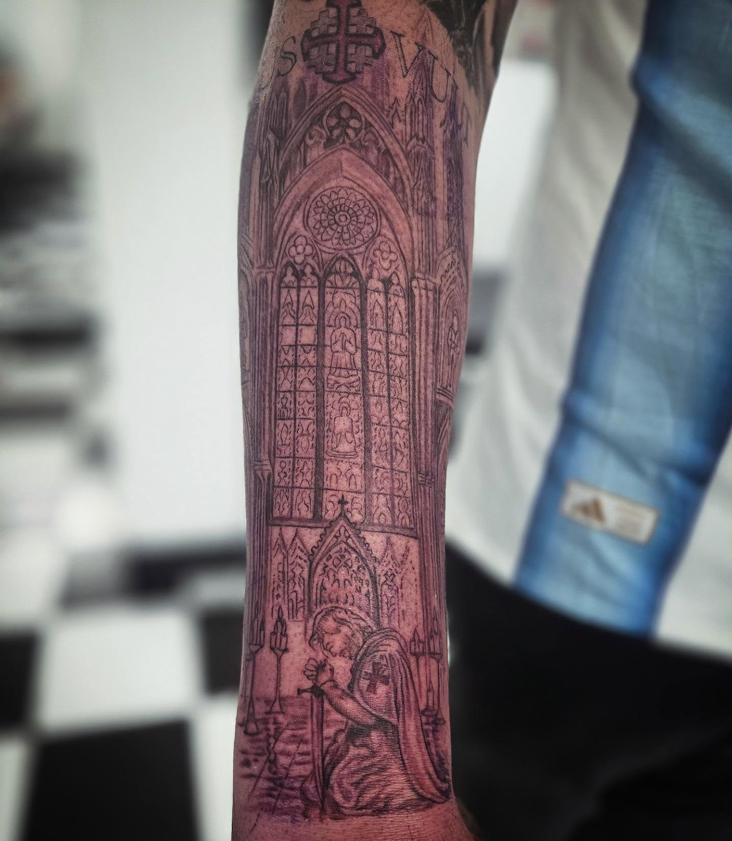 Gothic cathedral black and grey tattoo on the forearm by Molly DeSmedt