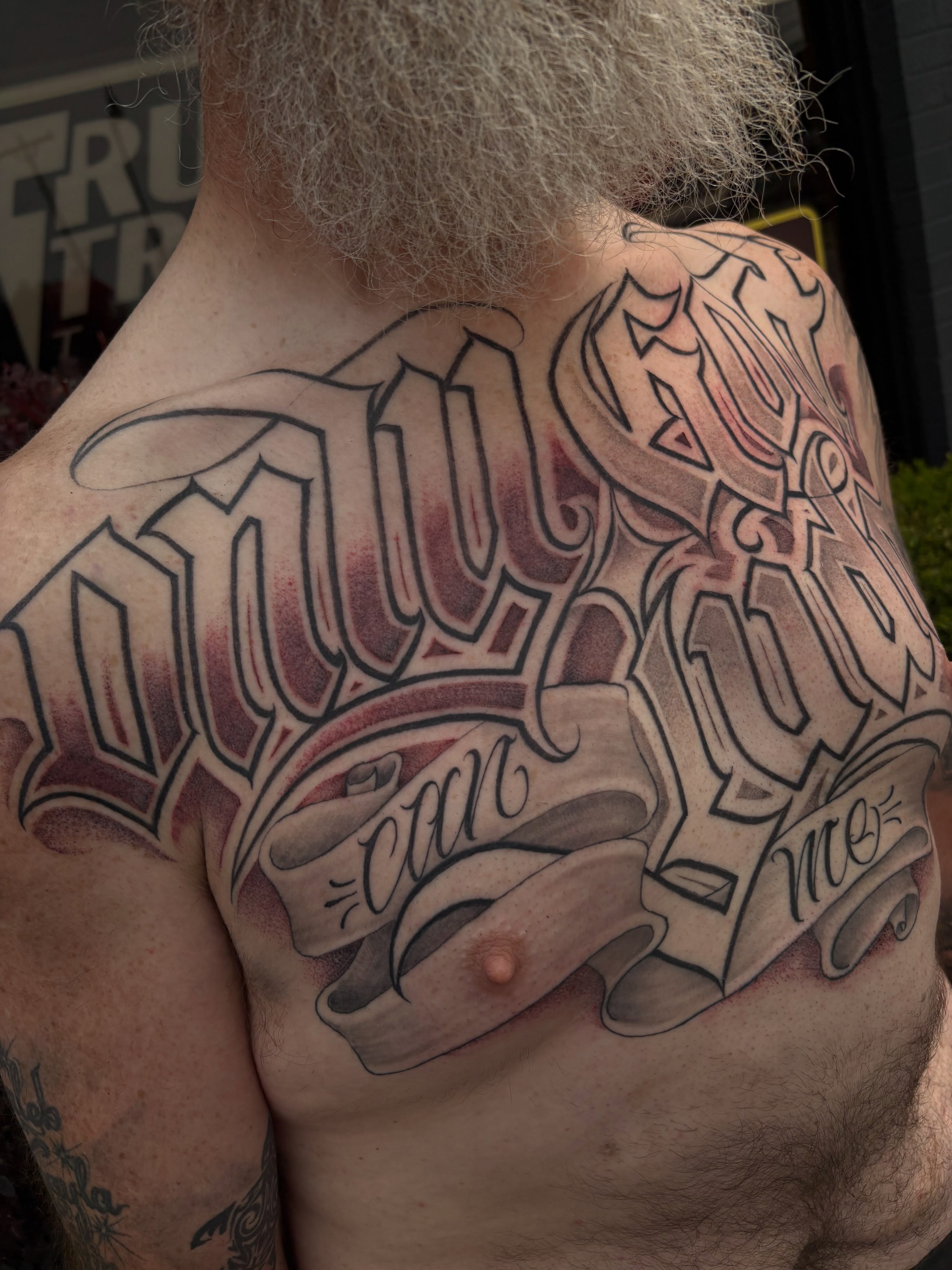 Script lettering lettering script tattoo on the chest by Trusty Dizon Tattoo Artist