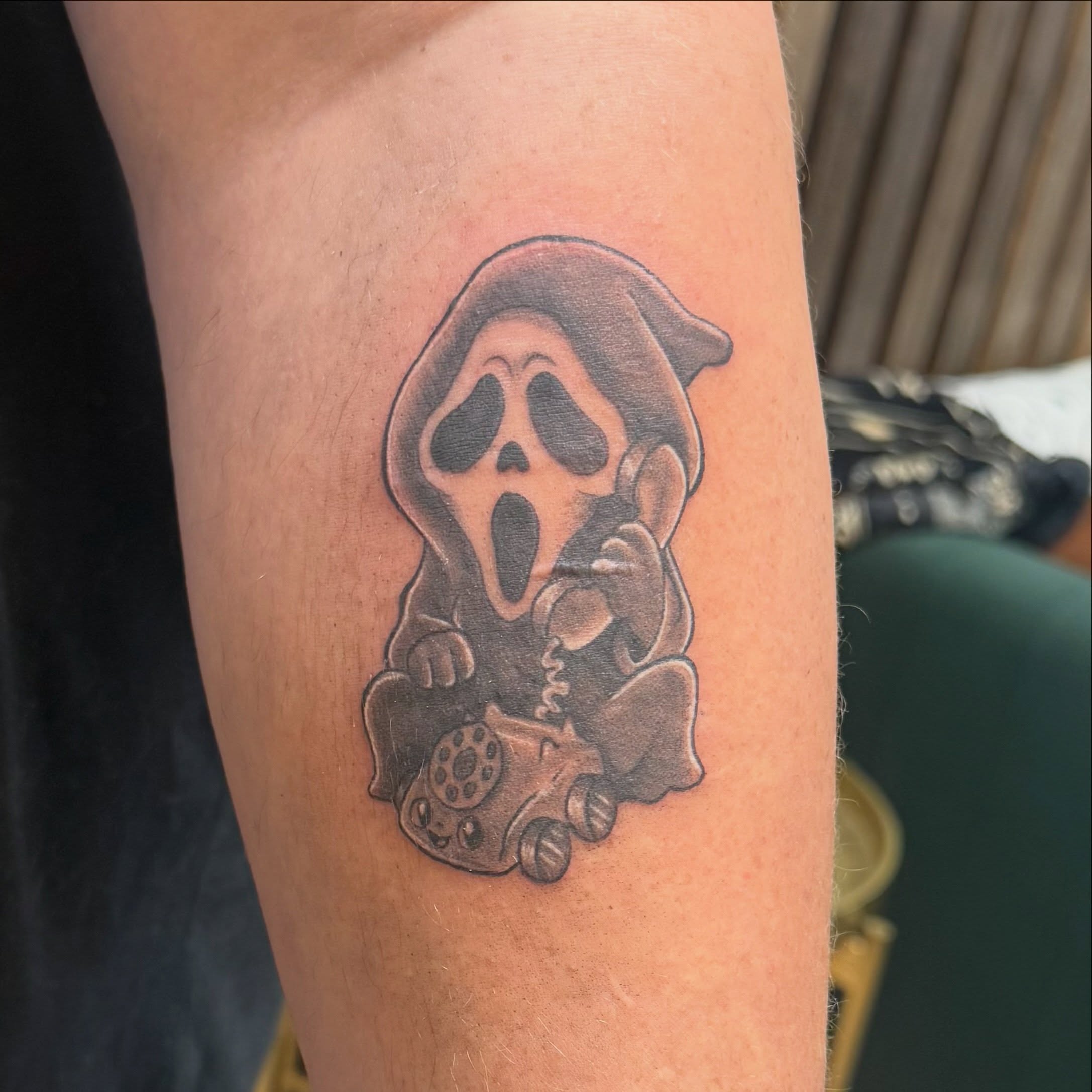Scream Ghost black and grey tattoo on the forearm by Kate Marie