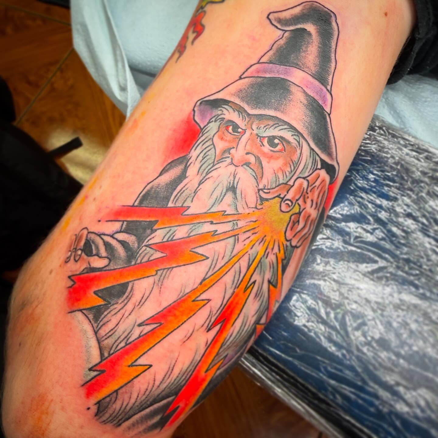 Wizard casting spell dotwork tattoo on the forearm by Mike Wilson