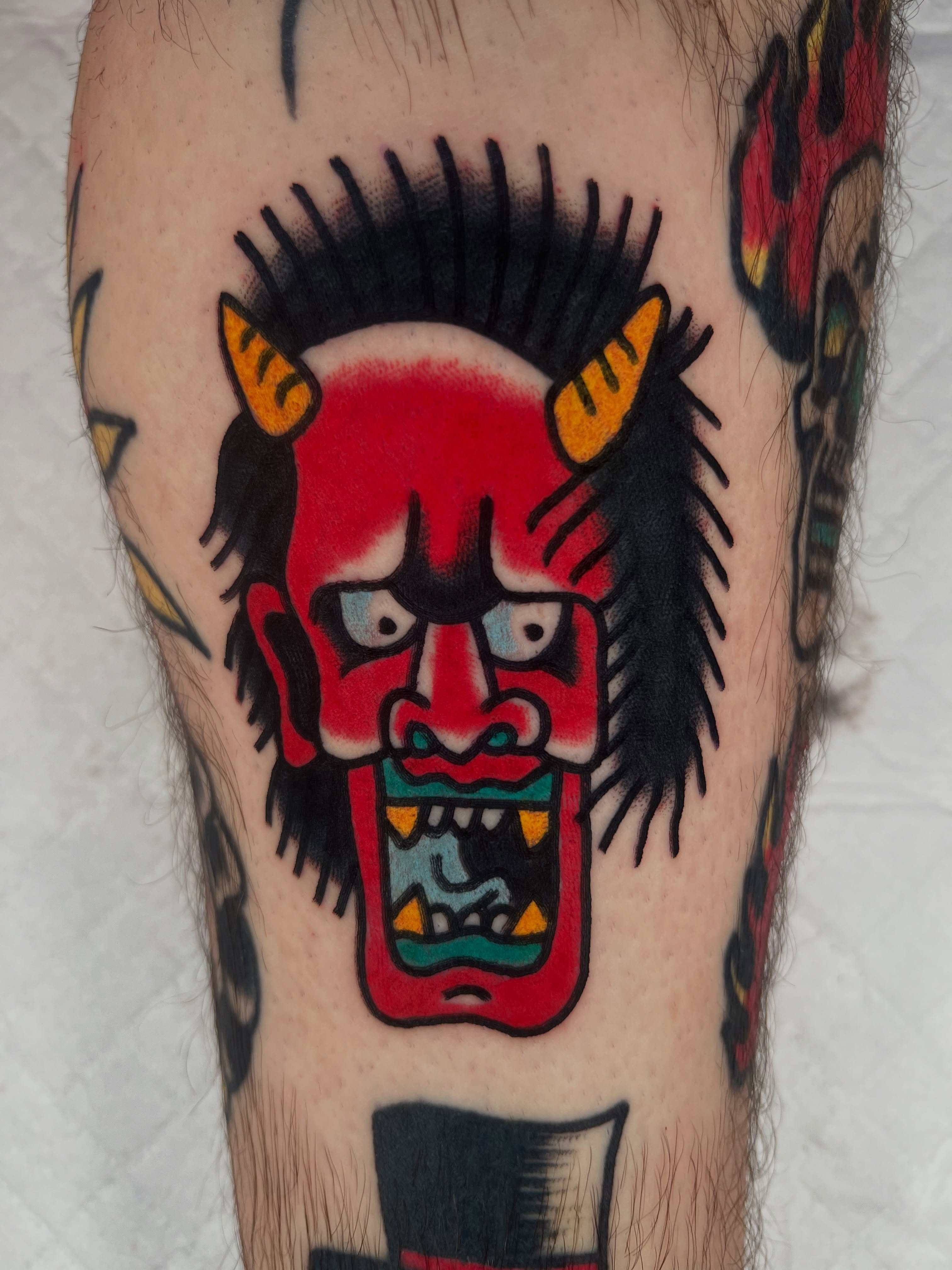 Demon mask American traditional tattoo on the forearm by Like A Horse Corral