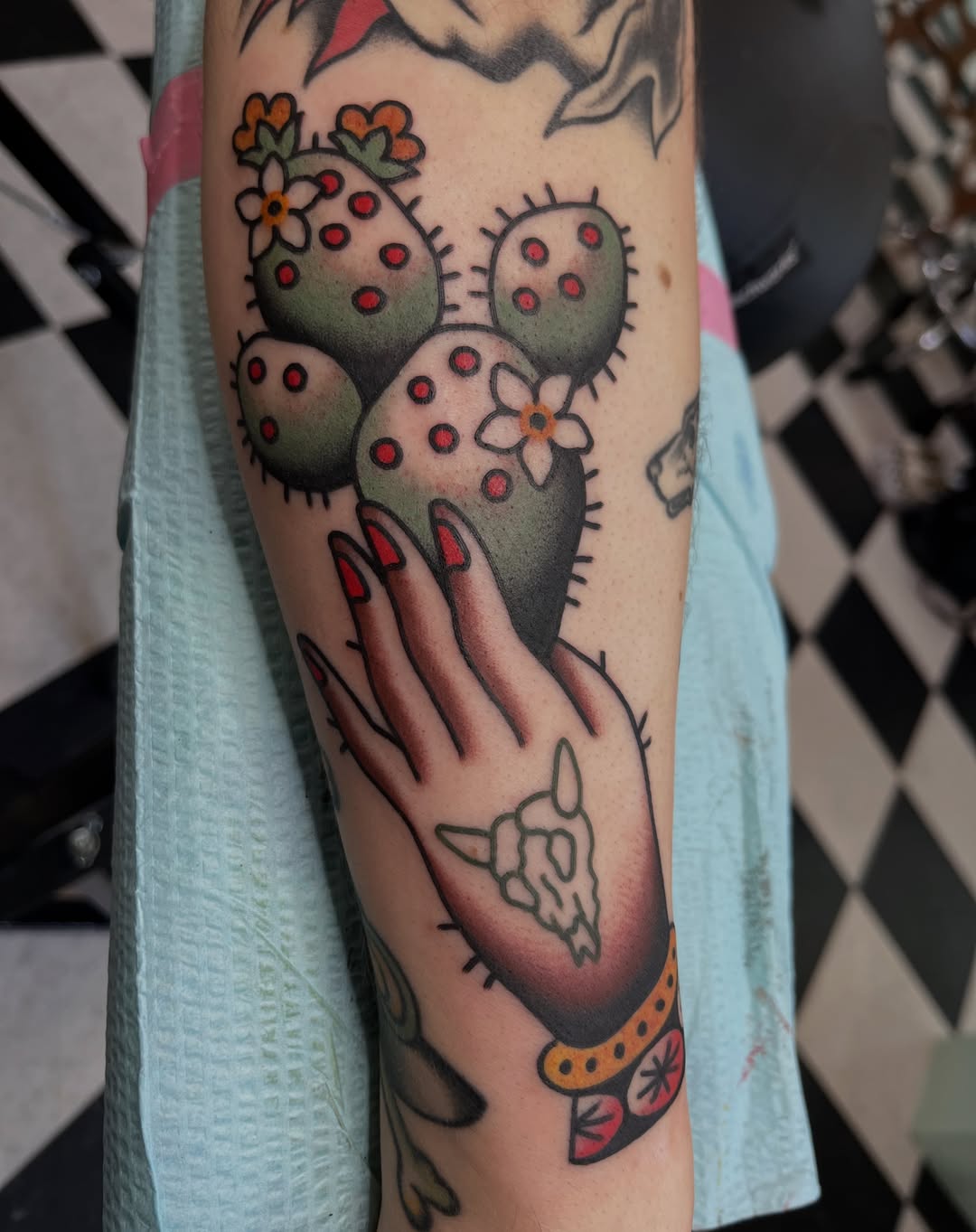 Cactus and hand American traditional tattoo on the forearm by Kayla Gibson, Portland, Oregon
