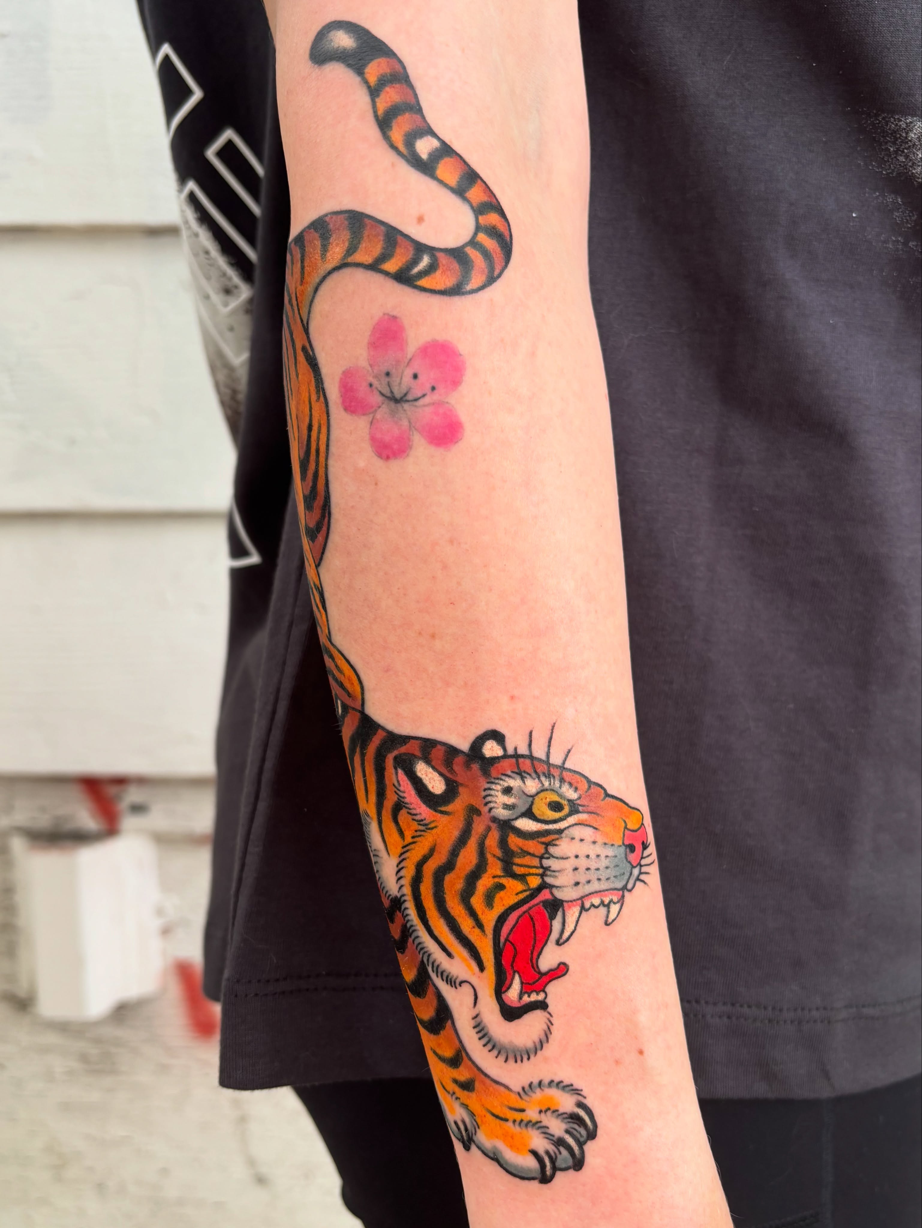 Tiger and flower American traditional tattoo on the forearm by Mike Maciejewski:Chicago Tattoo Artist