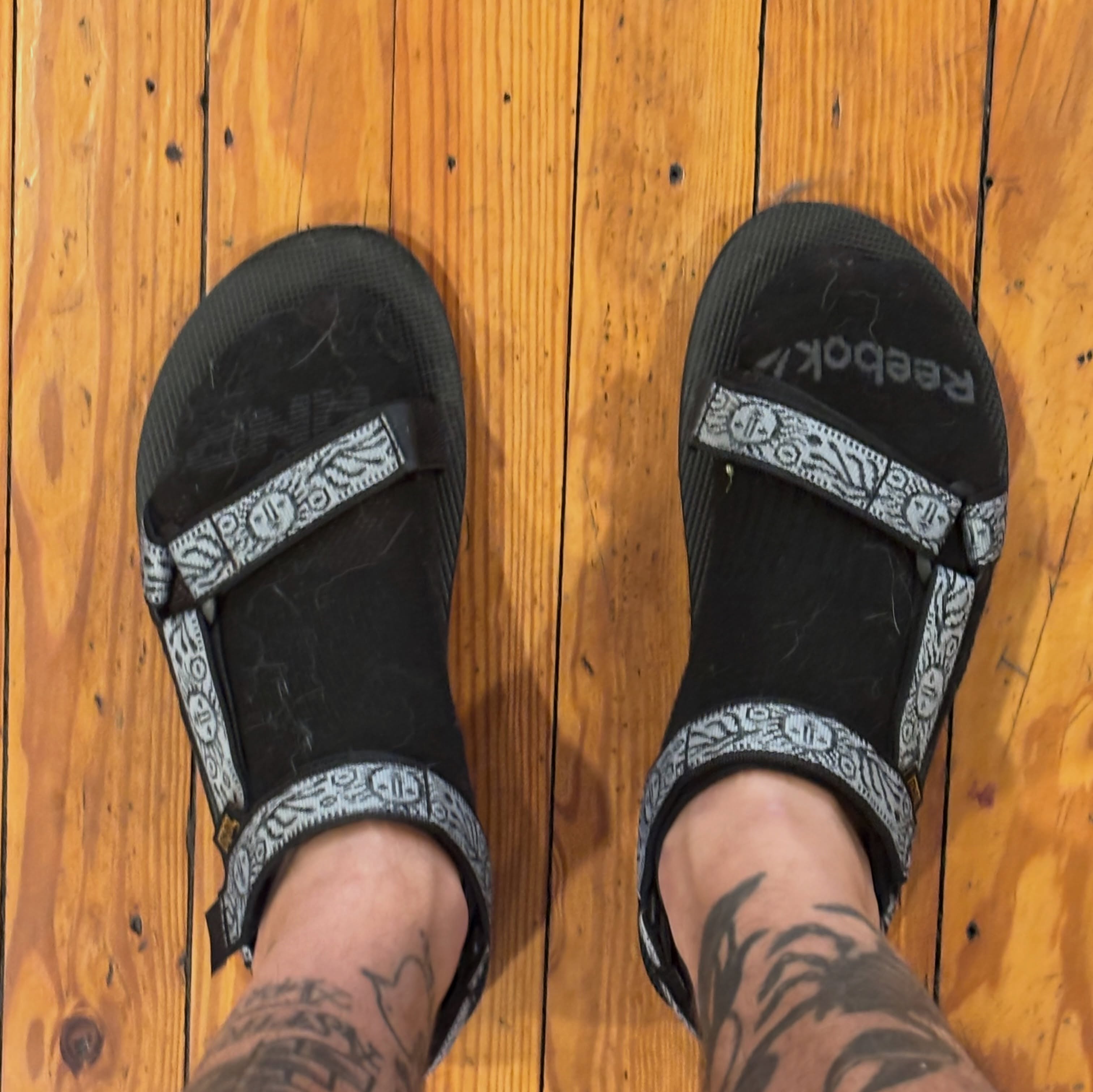 Tattooed feet black and grey tattoo on the foot by Malachi
