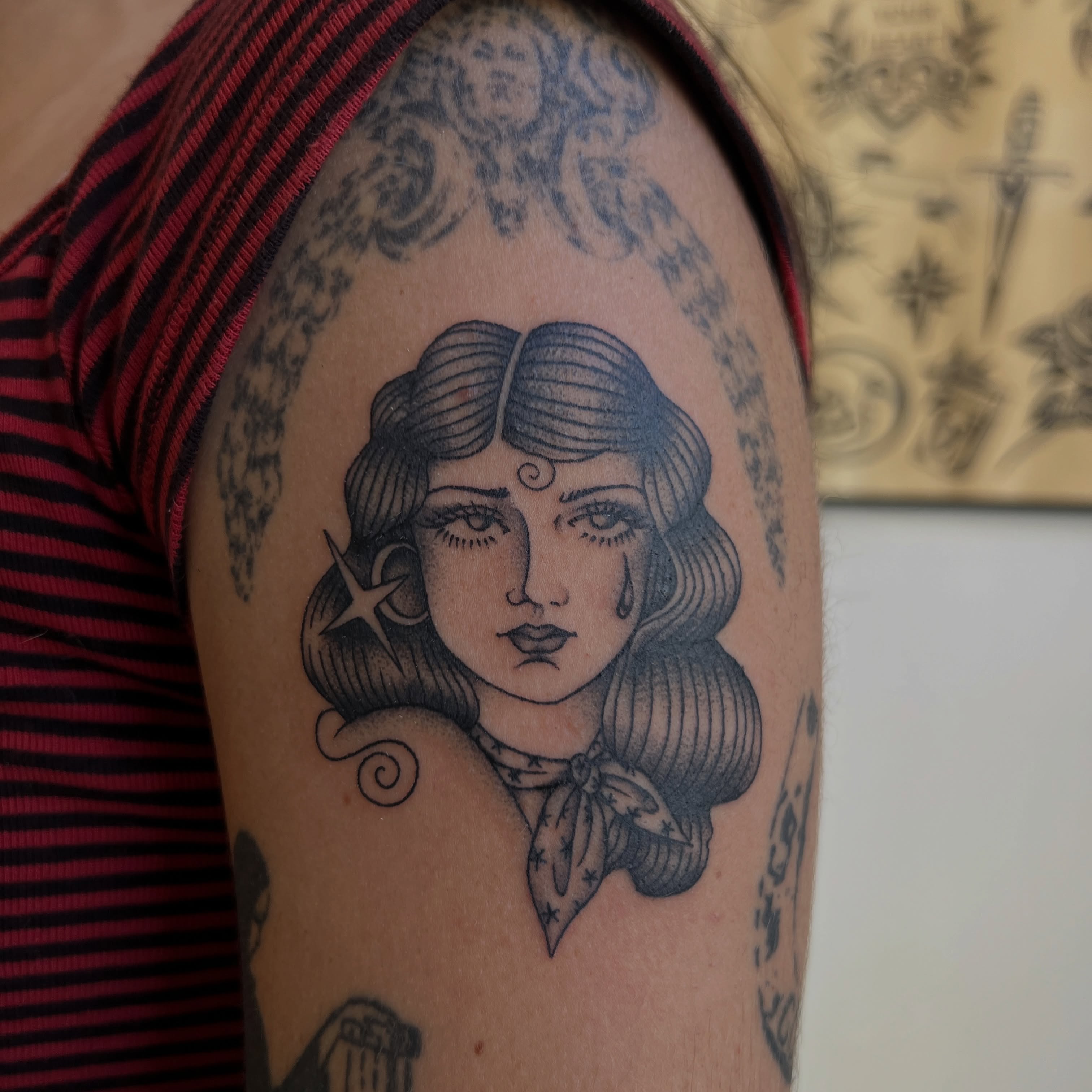 Woman with bandana black and grey tattoo on the shoulder by @syrenbier, San Francisco, California