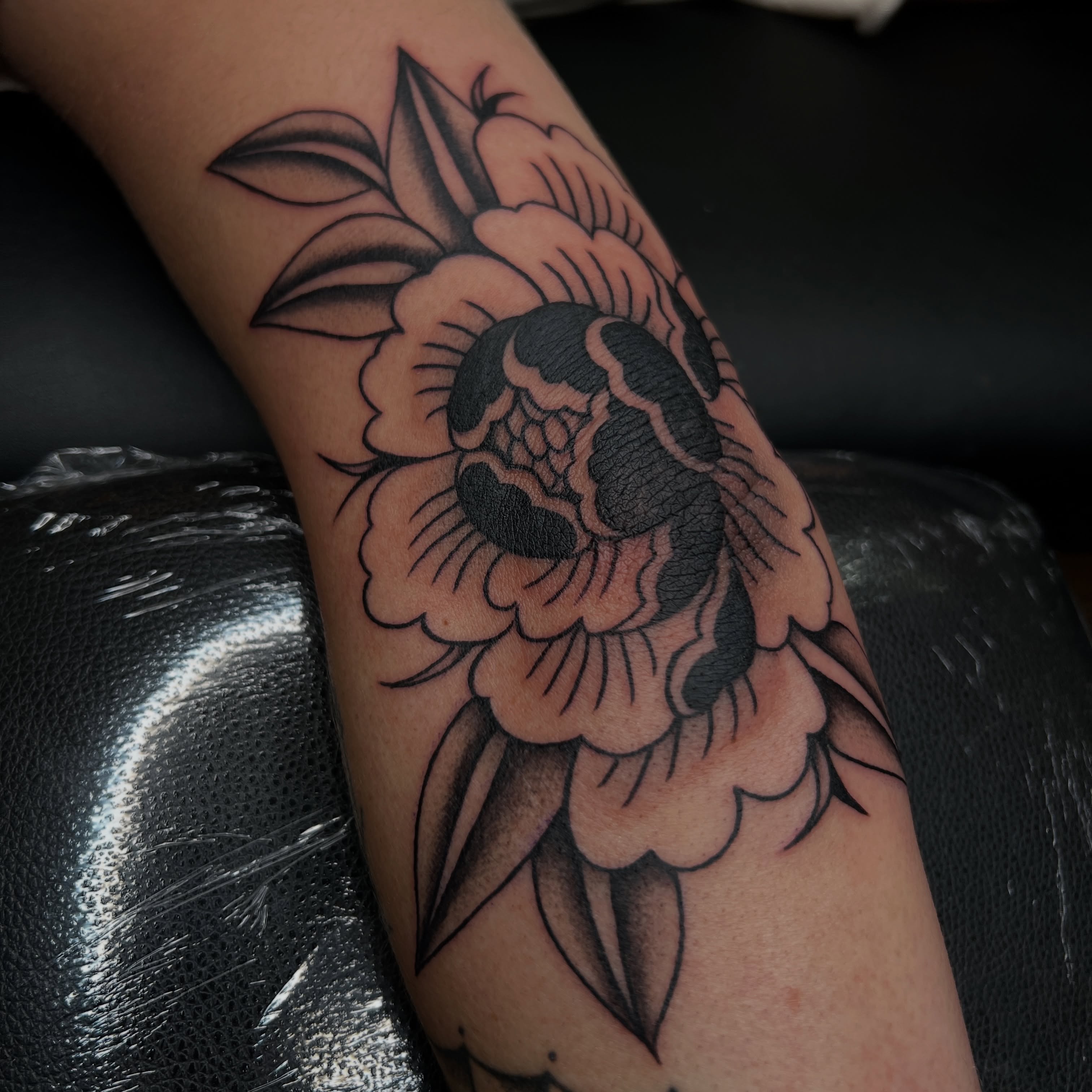 Peony flower American traditional tattoo on the forearm by @syrenbier, San Francisco, California