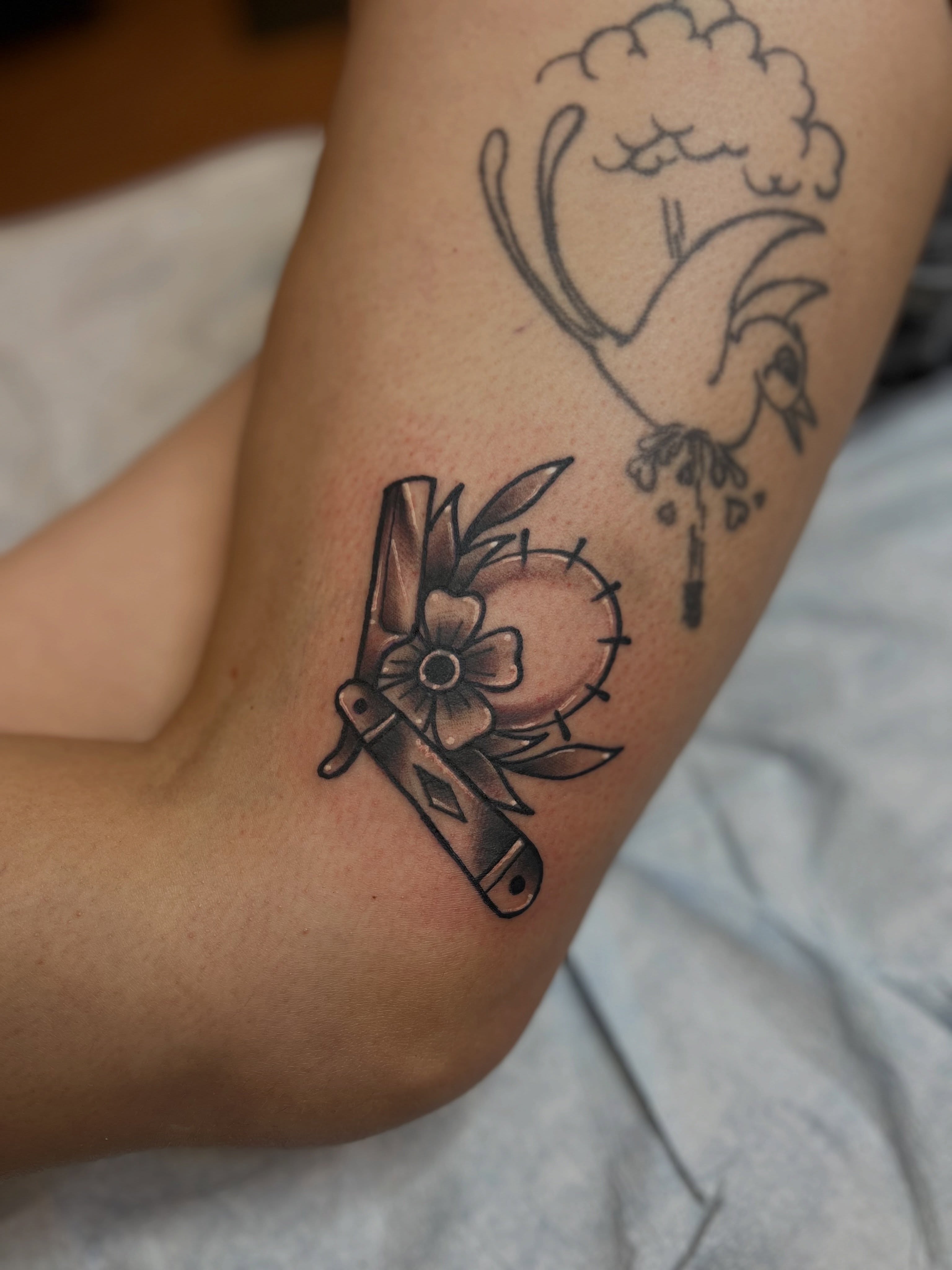 Knife and flower black and grey tattoo on the forearm by Fizzy Jizzles, Worcester, England