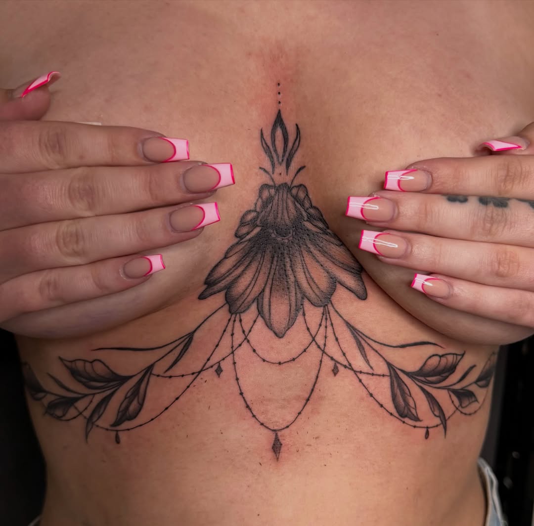 Lotus flower dotwork tattoo on the chest by savannah