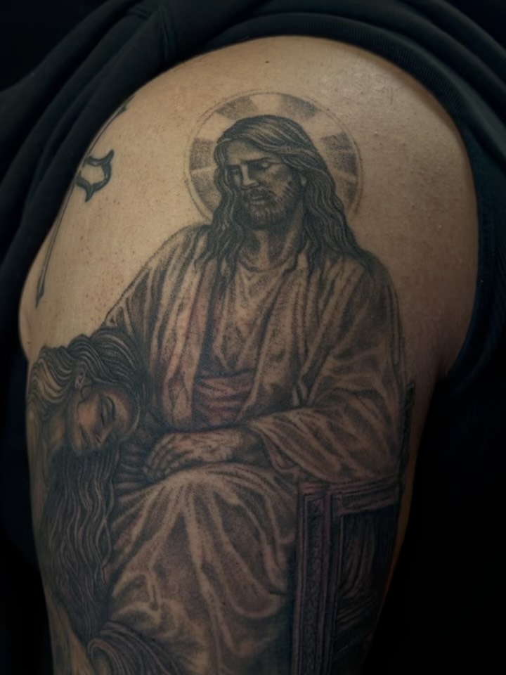 Religious scene realism tattoo on the shoulder by Yvonne