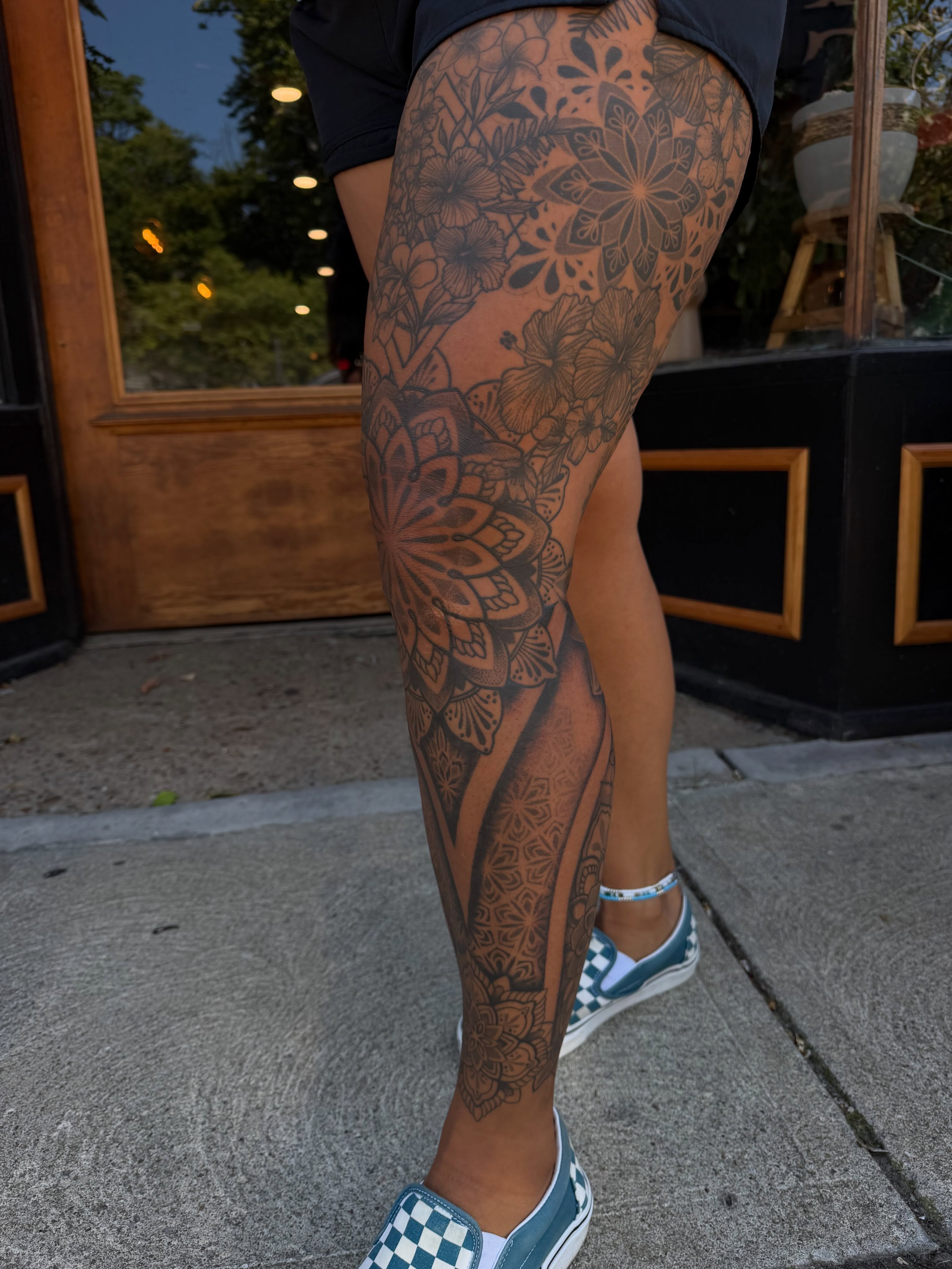 Floral mandala geometric tattoo on the leg by Allison