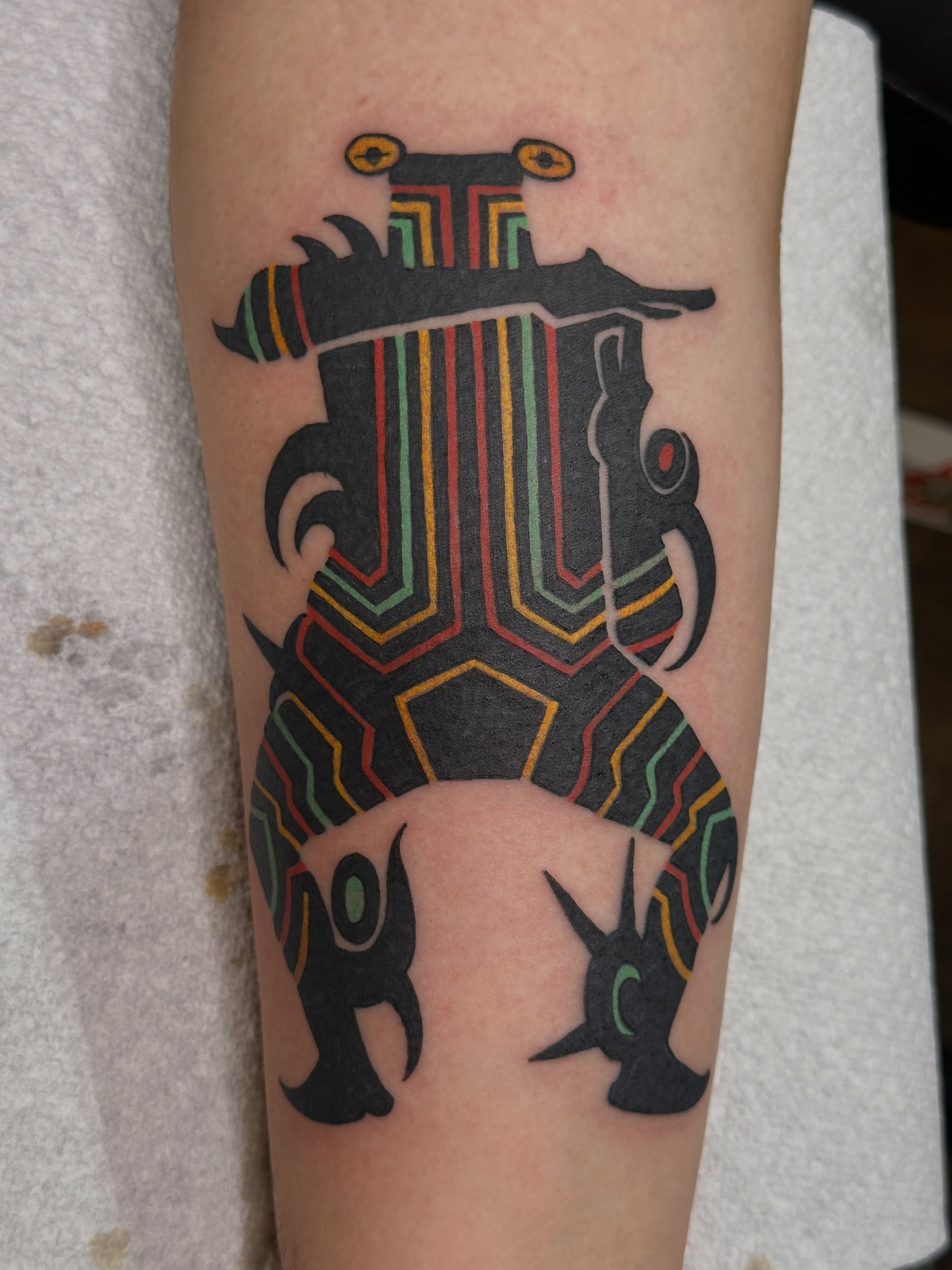 Geometric harp geometric tattoo on the forearm by bryce duval