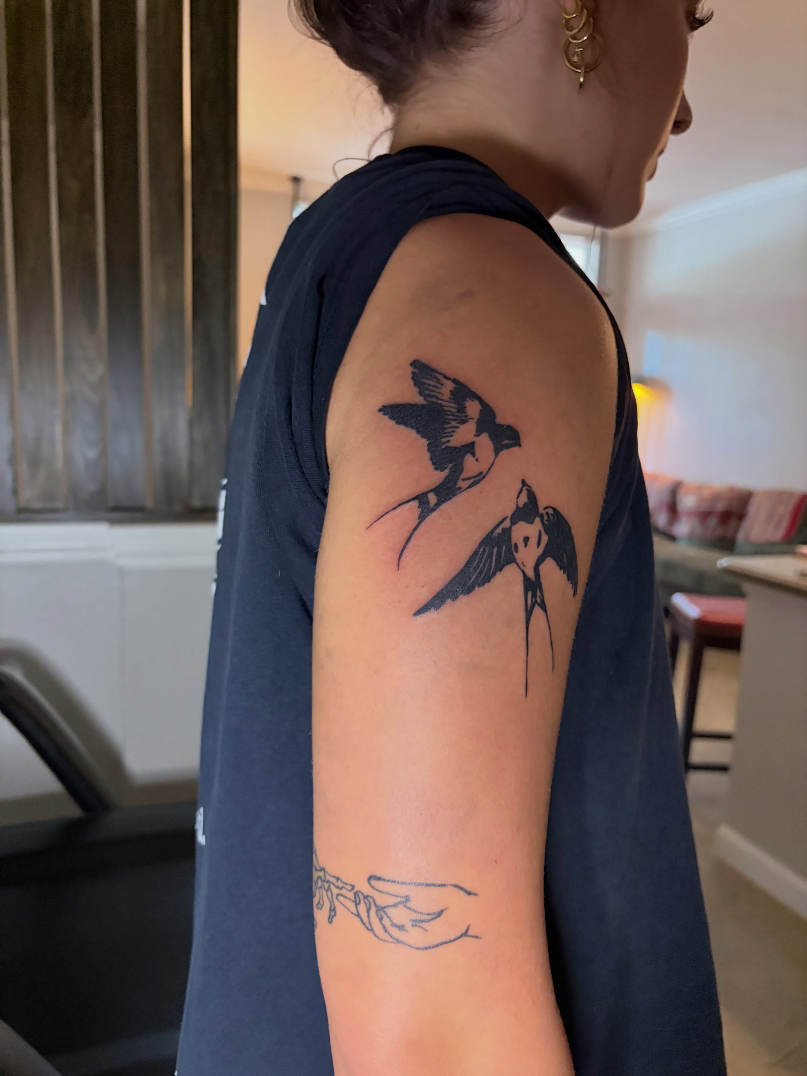 Swallows black and grey tattoo on the upper arm by blastedbybk