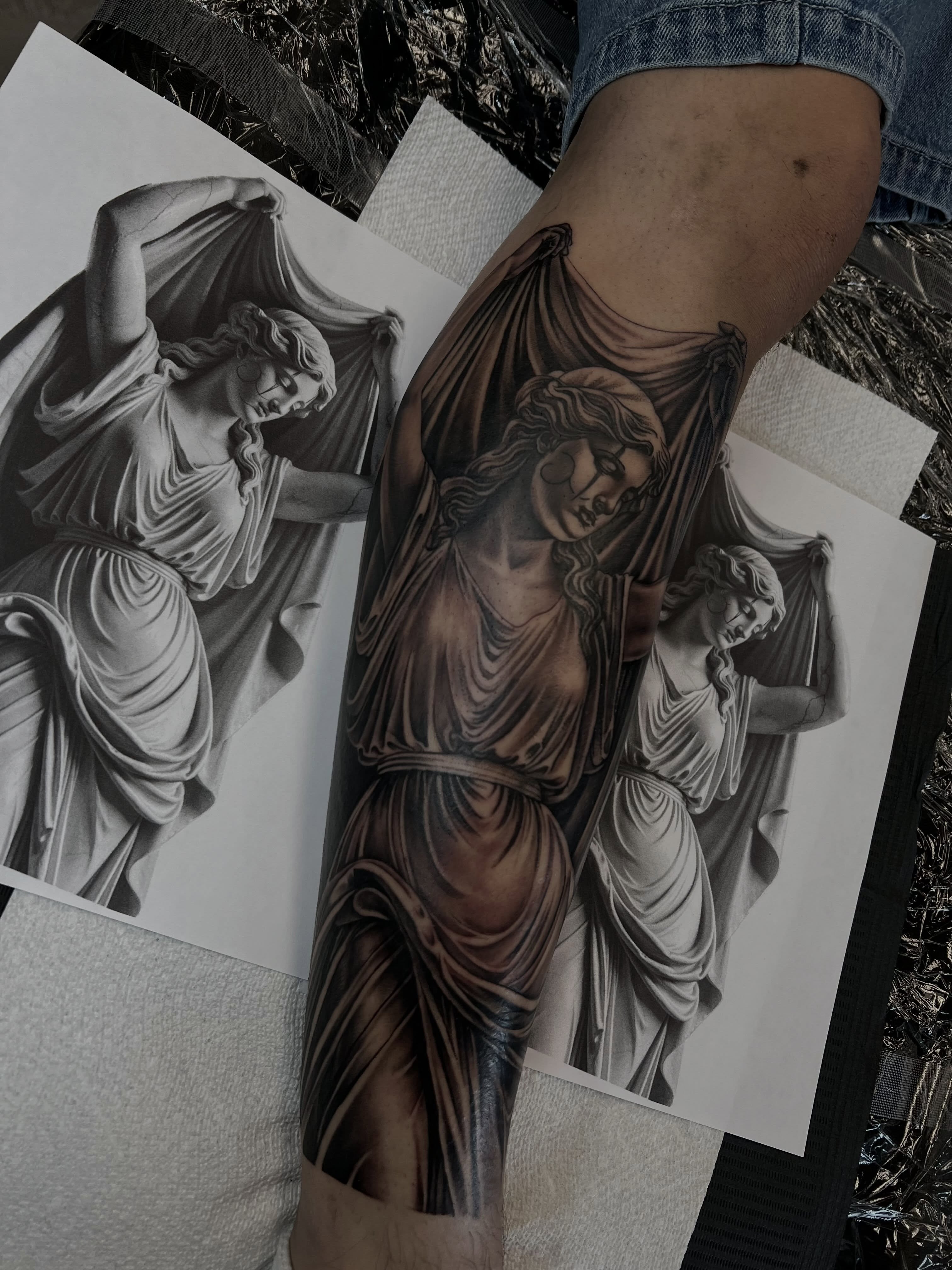 Statue realism tattoo on the forearm by Hugo Ruiz-Esparza