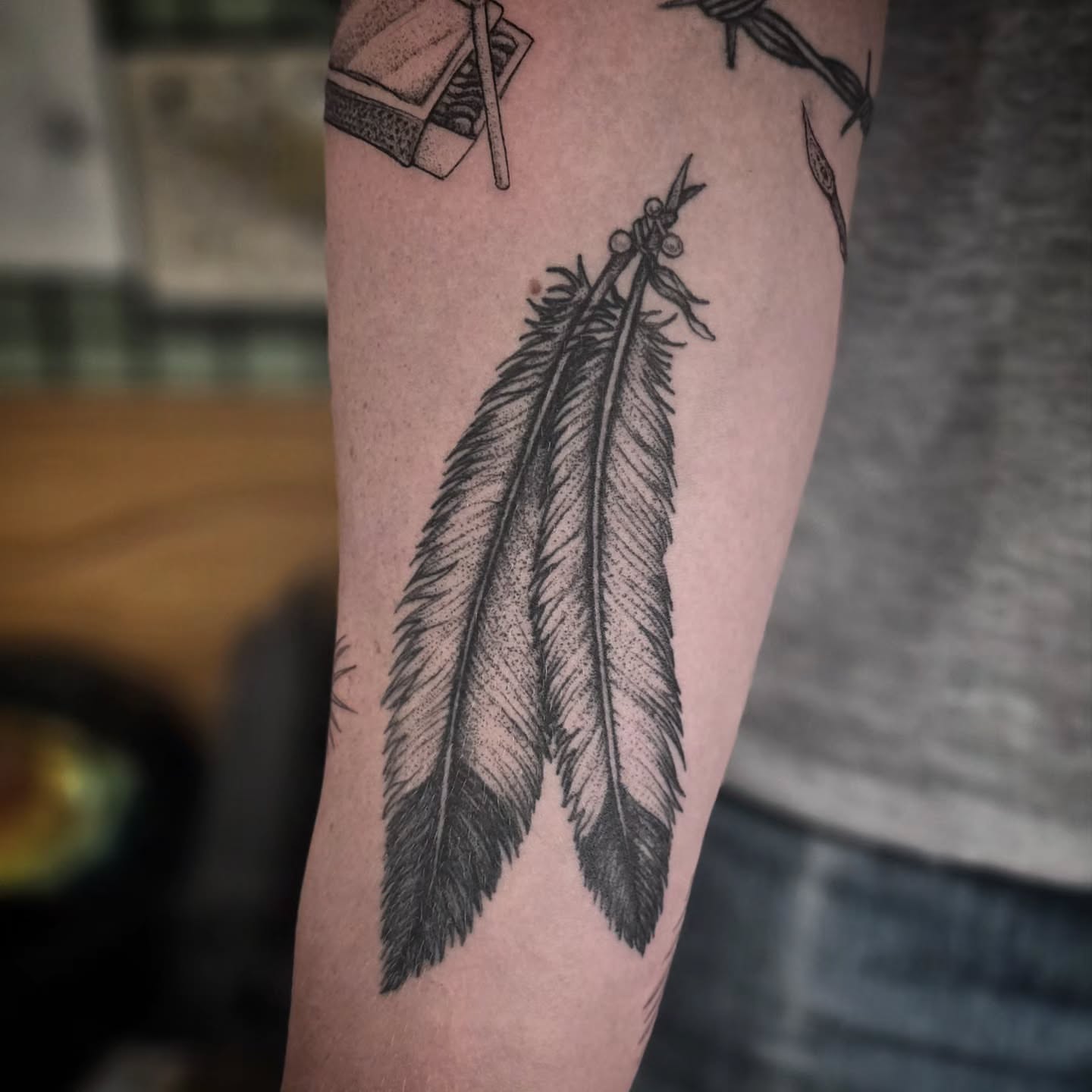 Feather black and grey tattoo on the forearm by brockton a f 💀