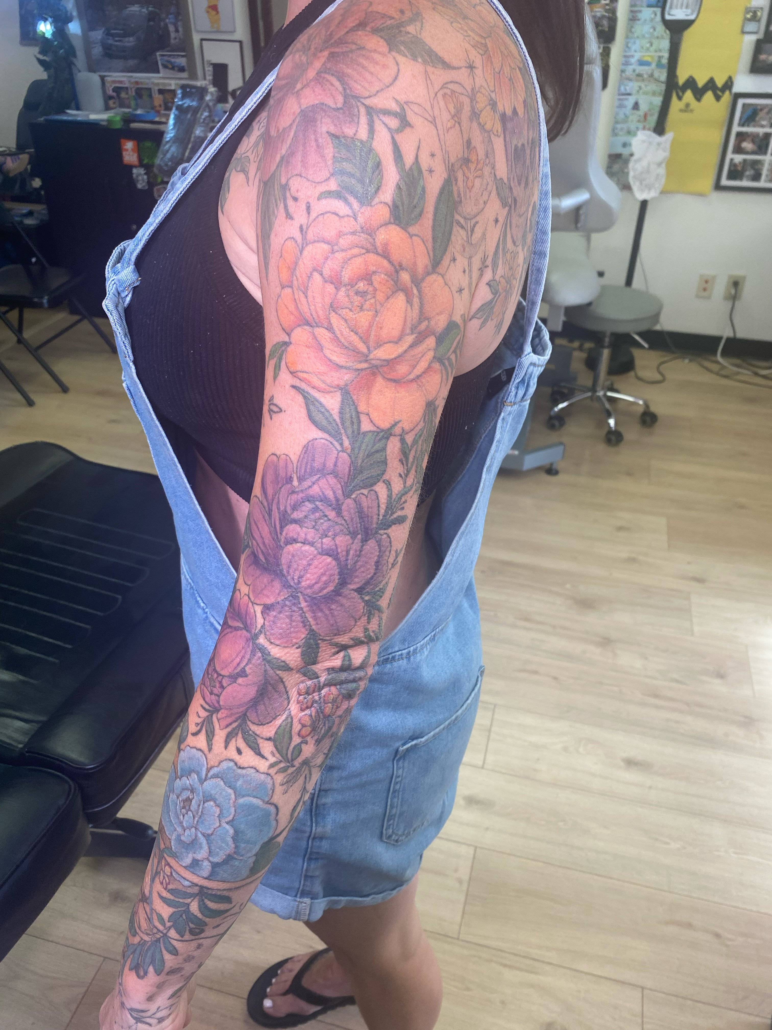 Floral bouquet American traditional tattoo on the upper arm by Katie Leeper